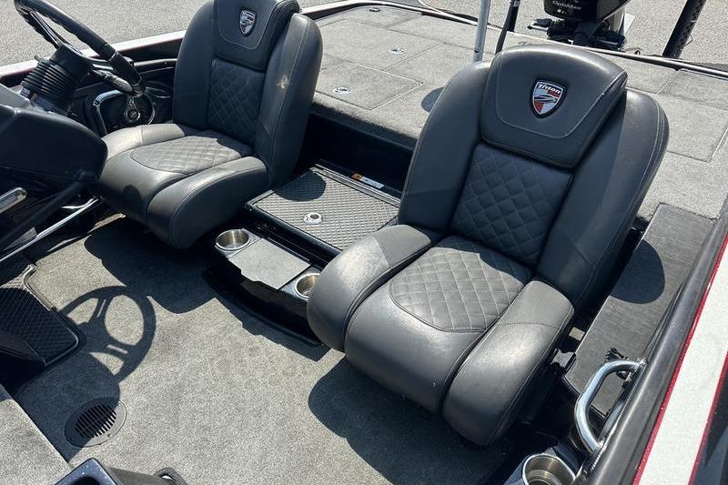 2016 Triton 20 TrX boat interior with two black leather seats.