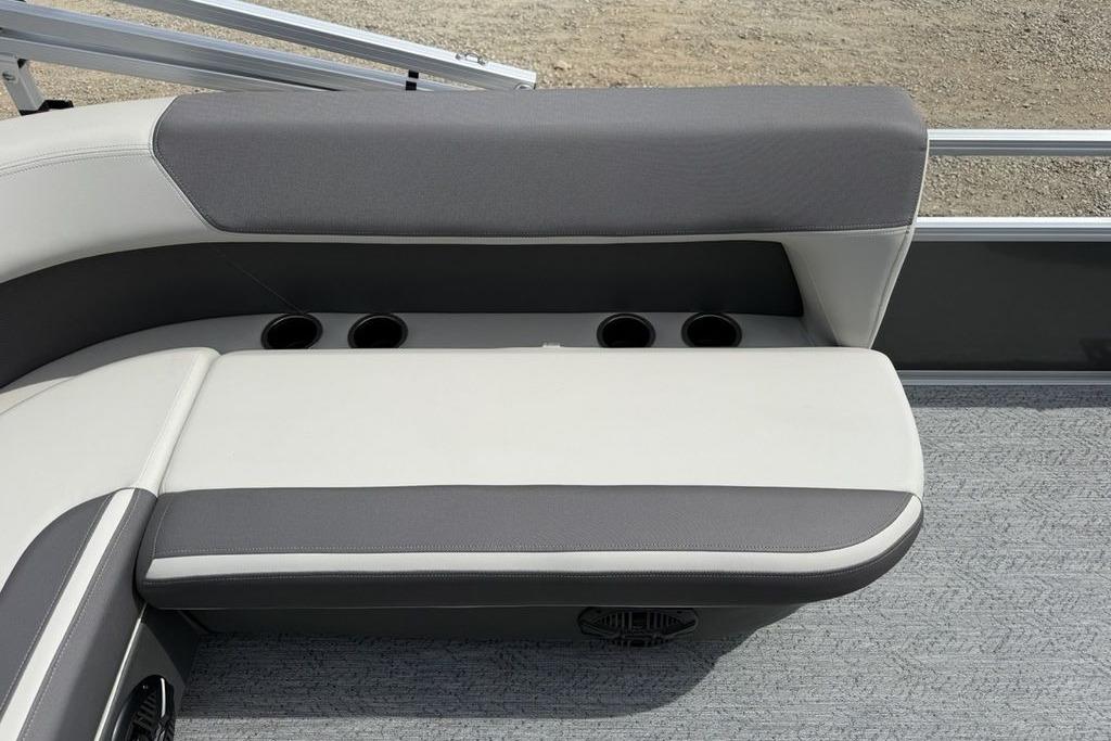 2026 Sun Tracker Bass Buggy 16 XL Select boat seating with cup holders and gray upholstery.