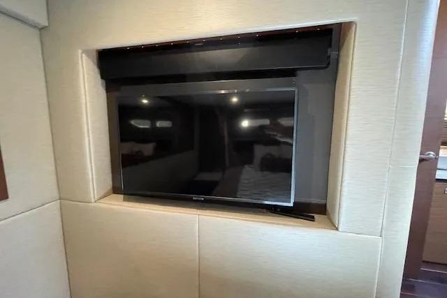 Built-in TV in 2016 Sea Ray Sundancer 510 yacht interior, showcasing modern luxury design.