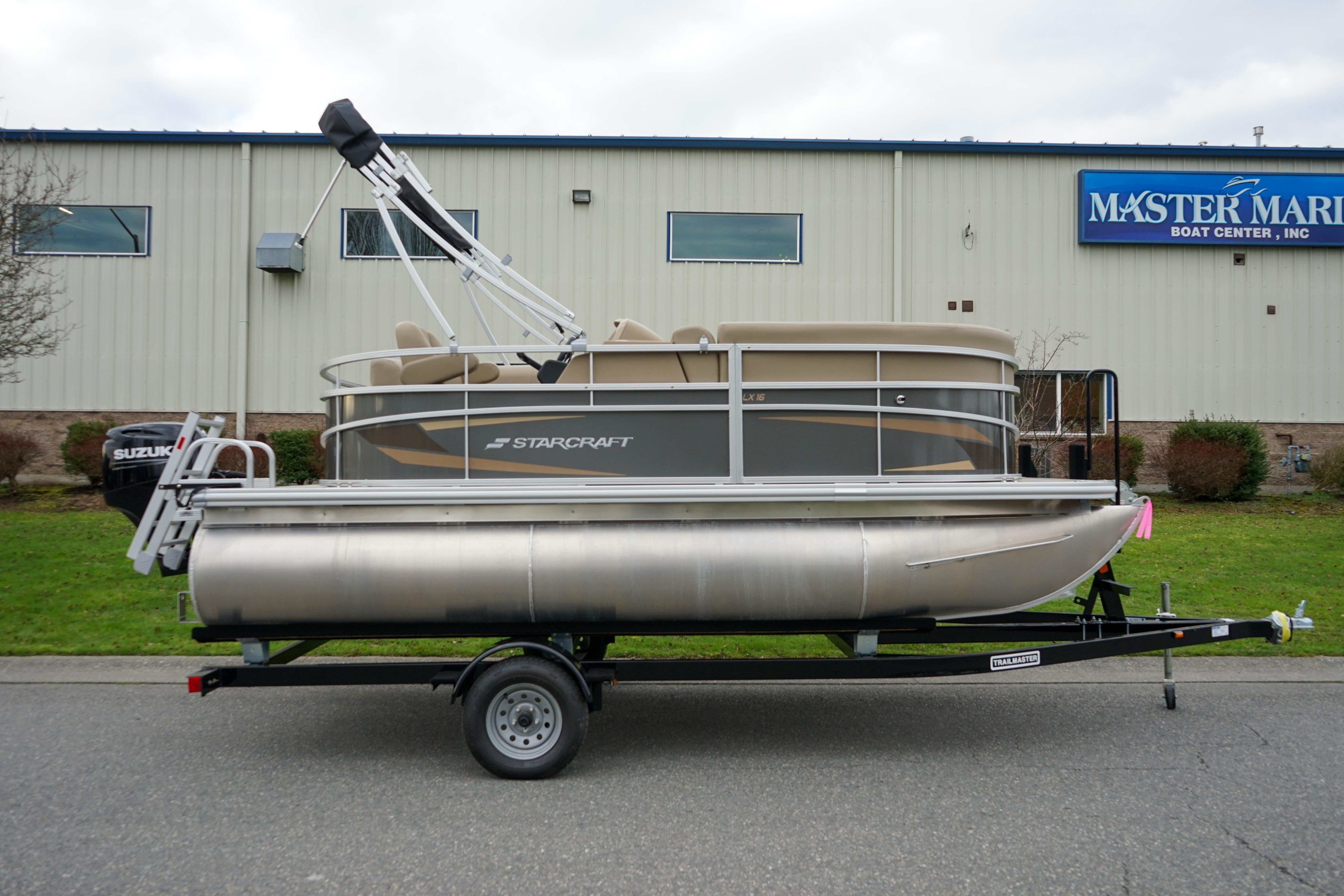 2025 Starcraft LX16R pontoon boat on trailer outside Master Marine Boat Center.