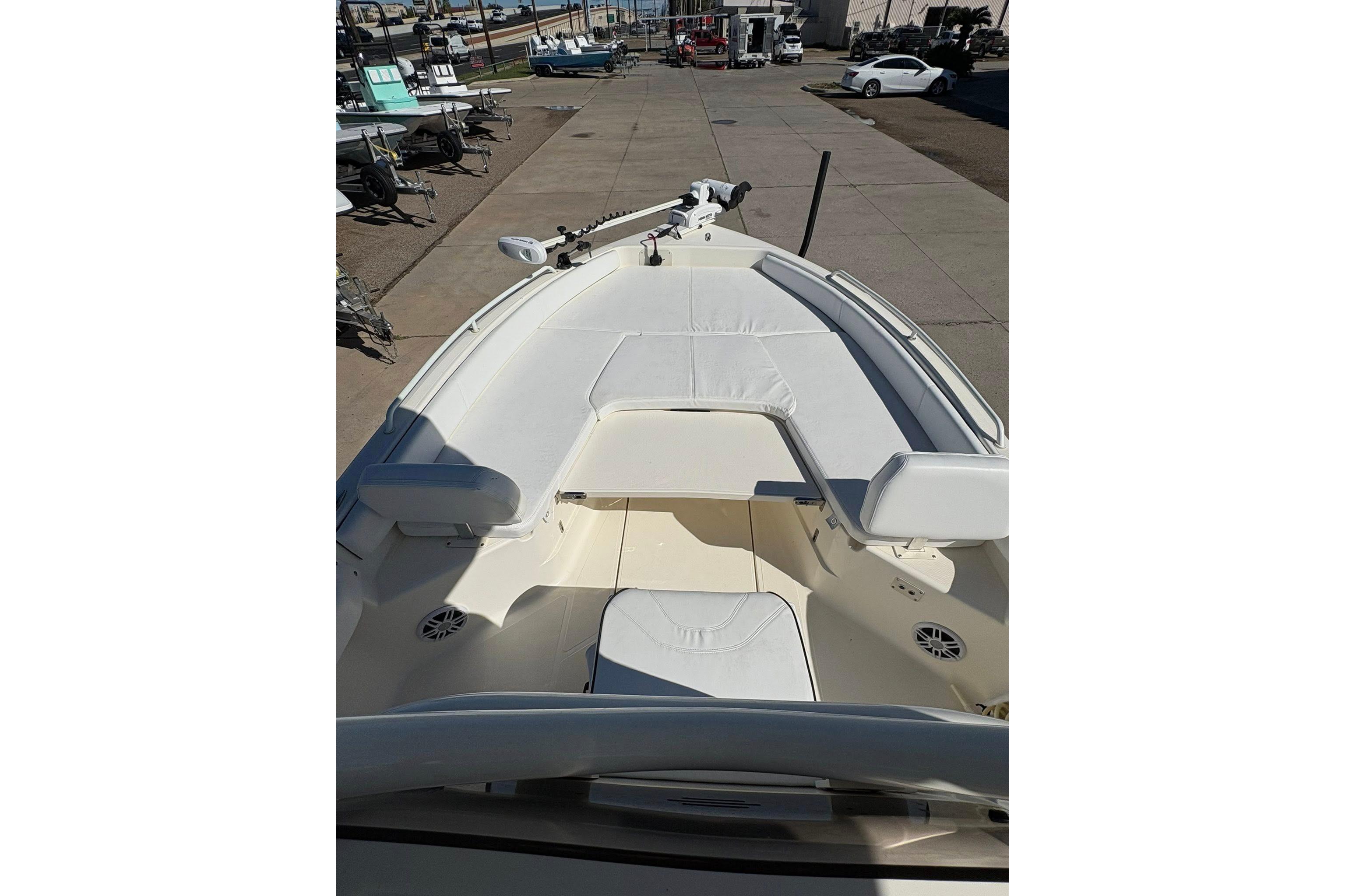 2023 Skeeter SX2550 Family boat interior with white seating and deck.