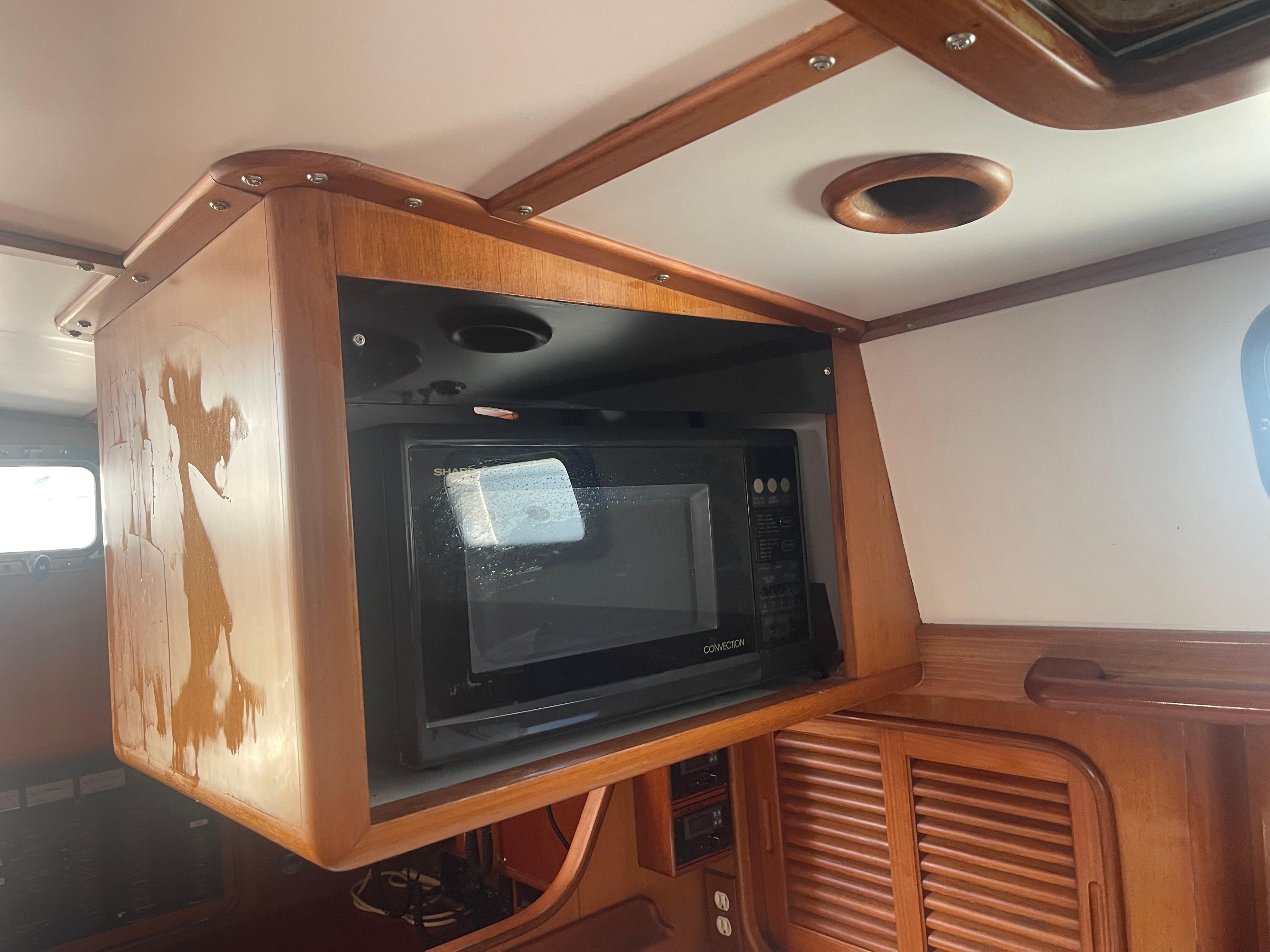 Built-in microwave in the galley of a 1995 Passport 47 AC Plan B sailboat.