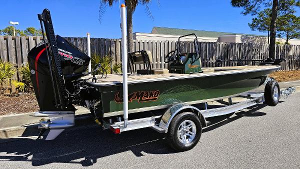 2025 Mako 18 Pro Skiff Backwater Edition on trailer, parked outdoors.