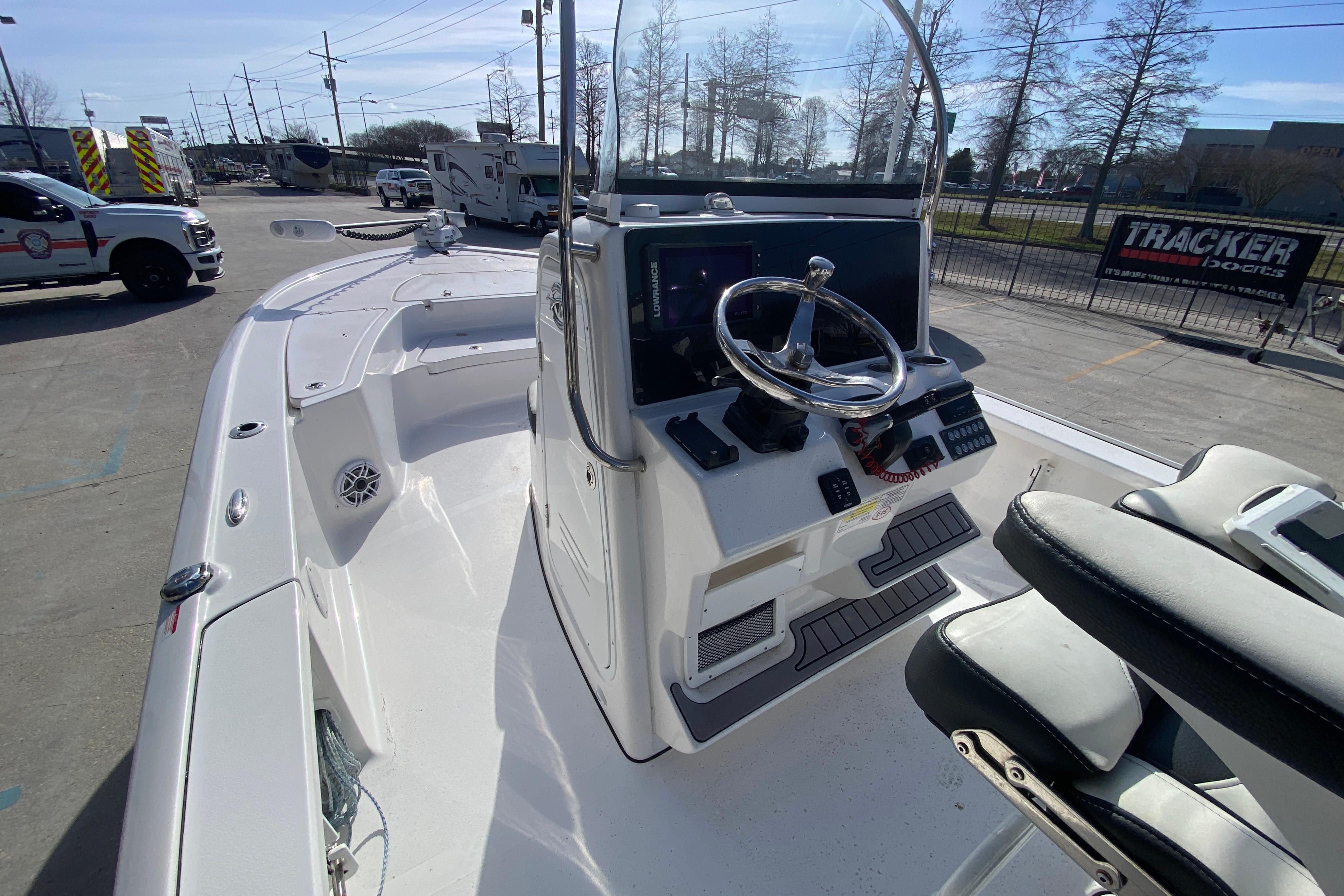 2023 Tidewater 2410 Bay Max boat interior with steering console and seating.