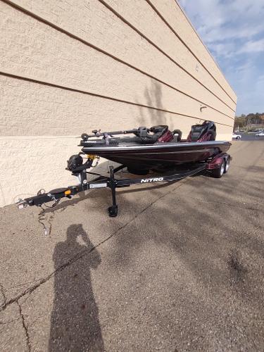 2024 Nitro Z21 XL boat on trailer, parked outdoors.