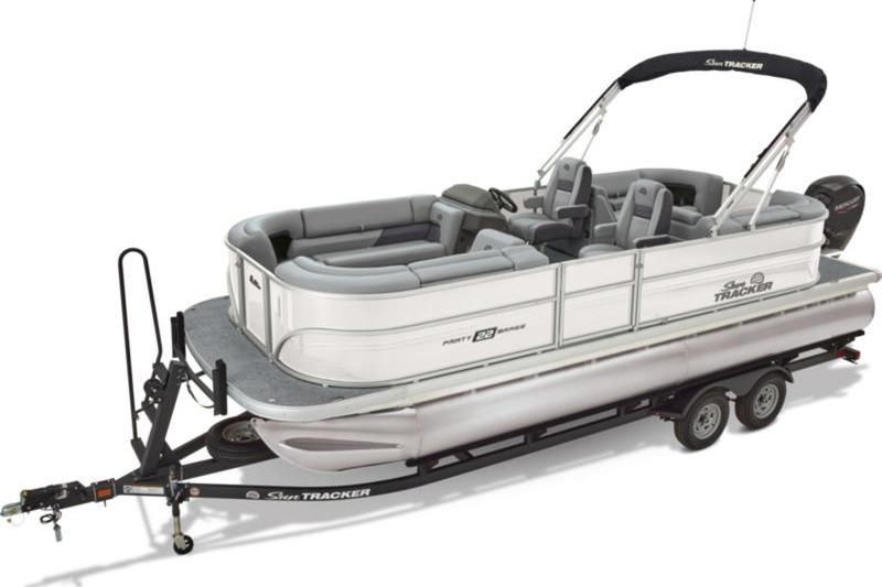 2026 Sun Tracker Party Barge 22 DLX pontoon boat on trailer, side view.