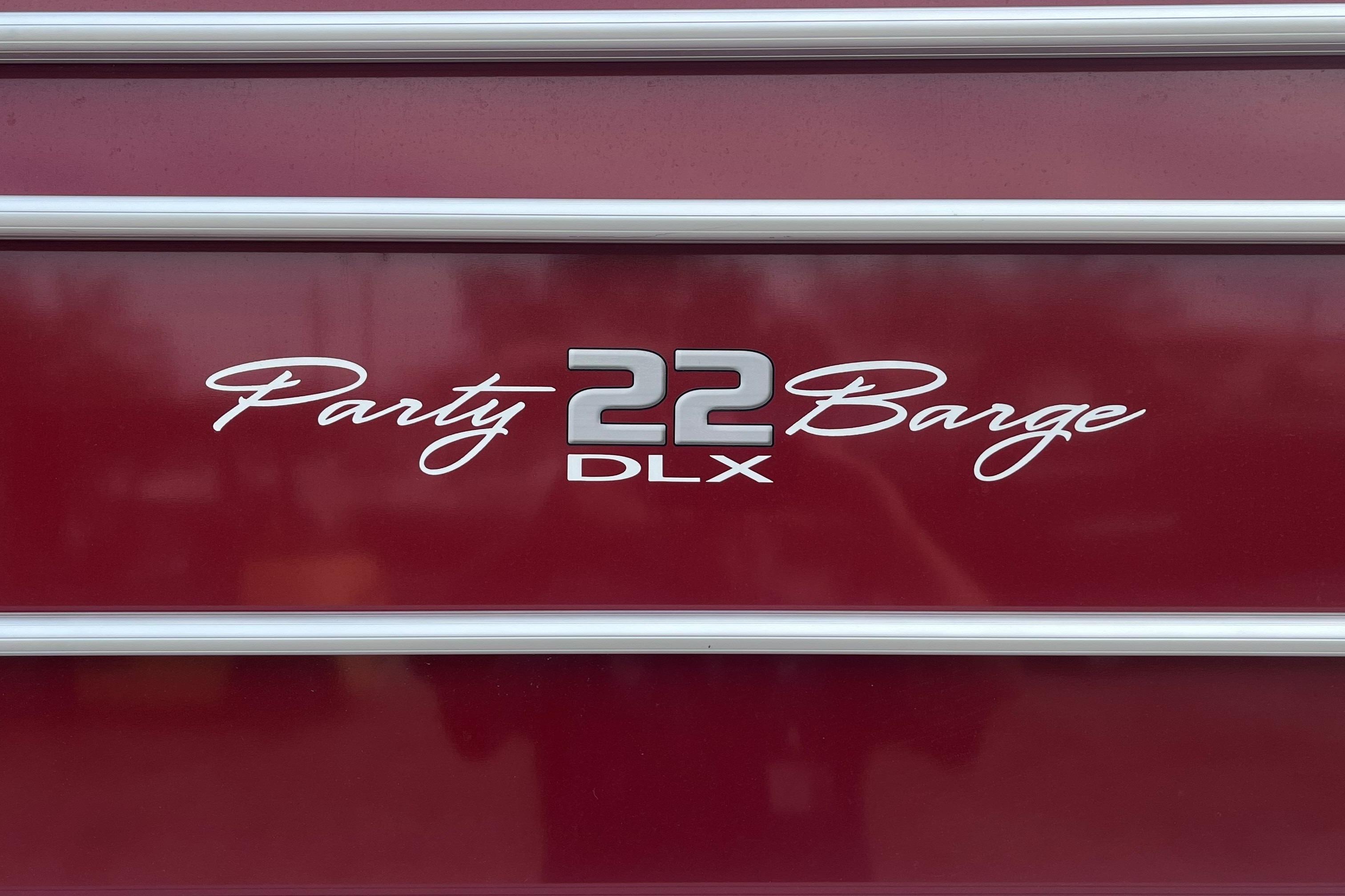 2023 Sun Tracker Party Barge 22 RF DLX logo on maroon background.