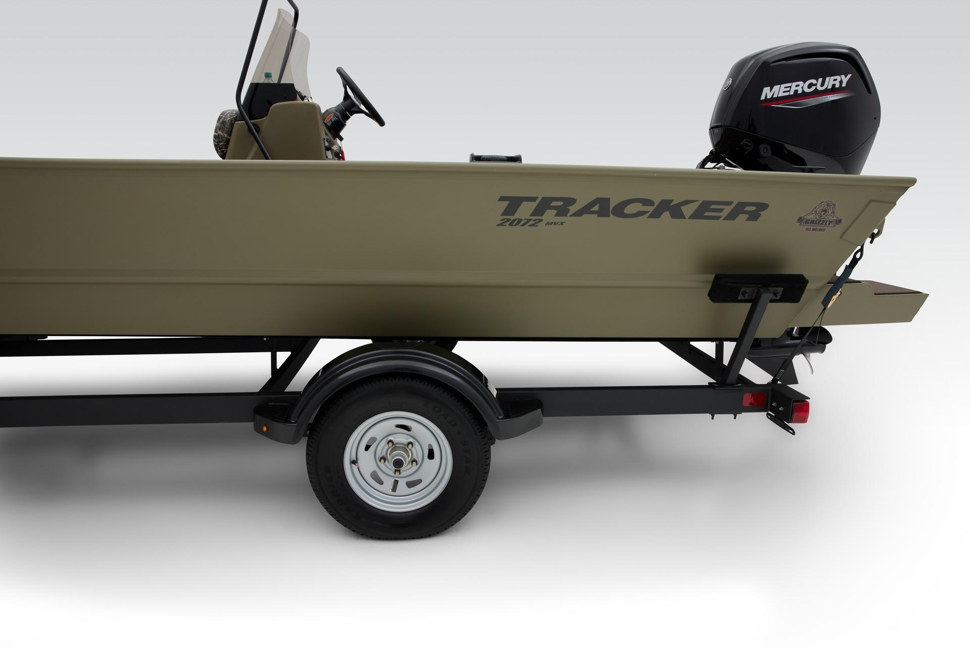 2024 Tracker Grizzly 2072 CC boat on trailer with Mercury outboard motor.