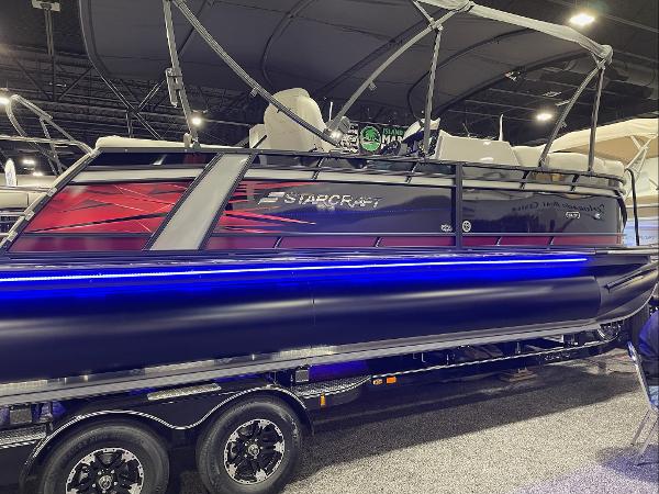 2022 Starcraft SLS-3Q DH pontoon boat with blue LED lights on display.