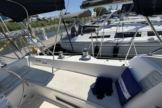 Cockpit view of a 2002 Saga 43 sailboat docked at a marina.