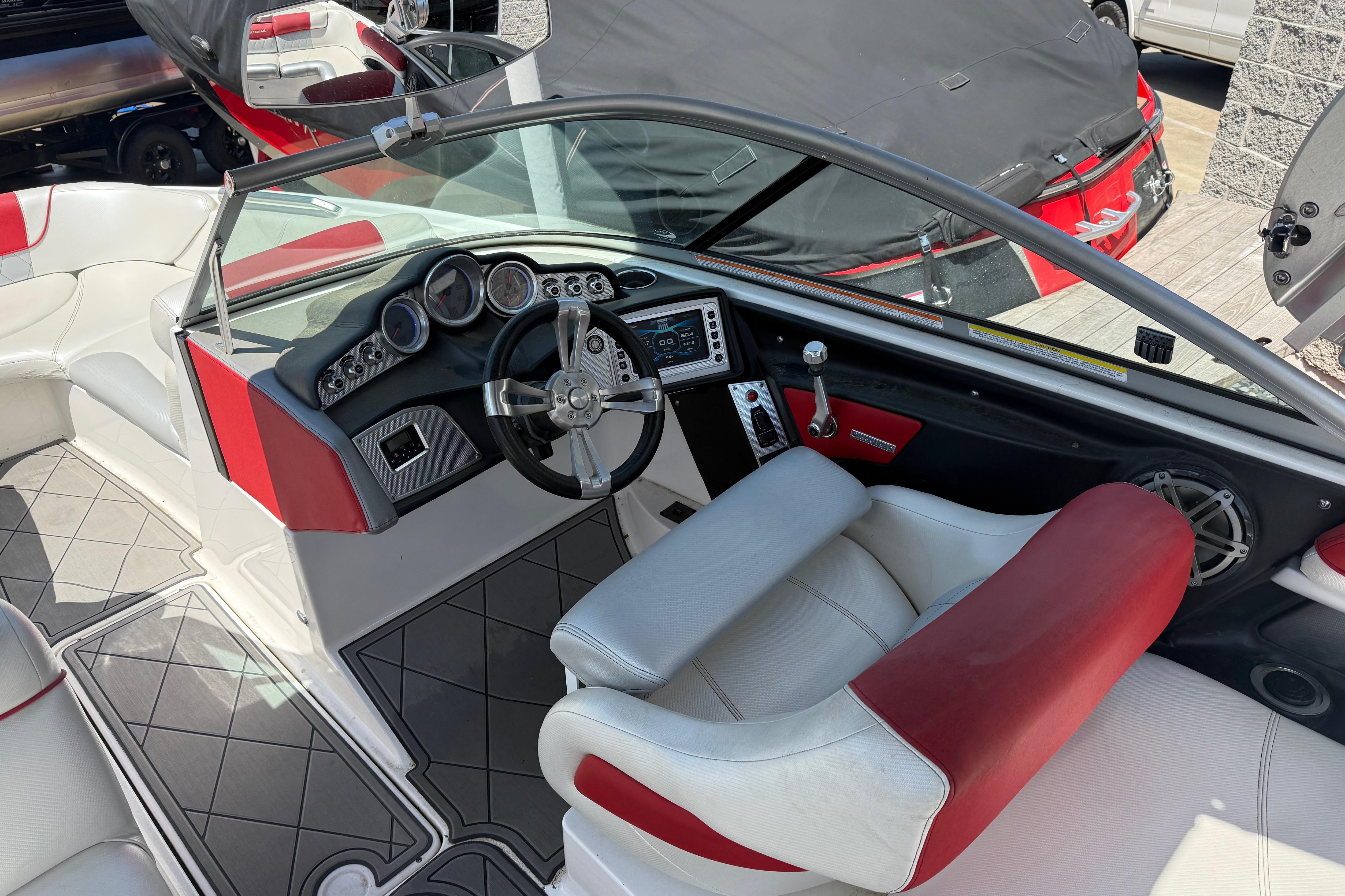Interior of a 2013 MasterCraft X-45 boat with red and white seating.