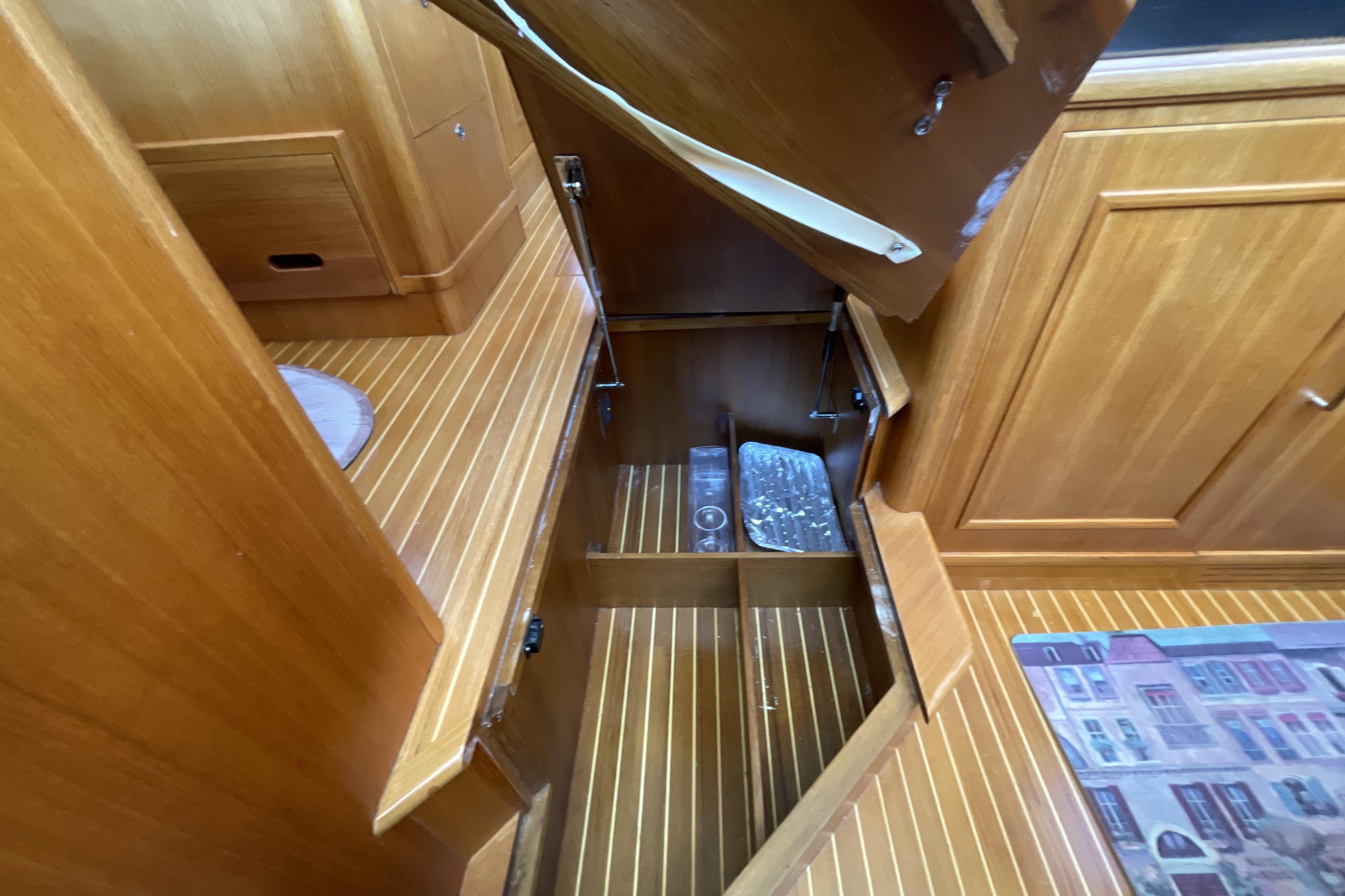 Wooden interior storage compartment on 2007 Grand Banks 47 Heritage CL yacht.
