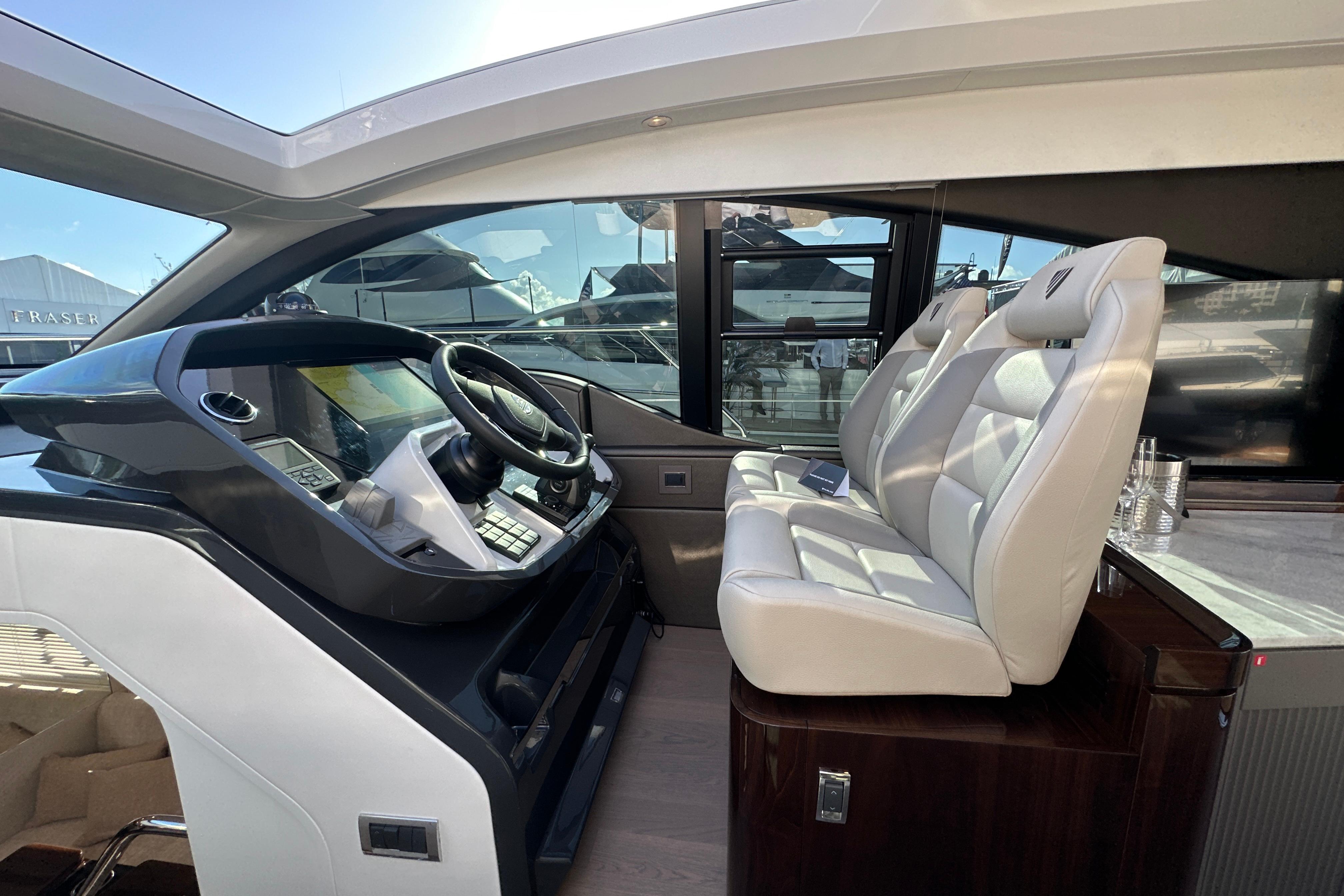 Interior of 2026 Fairline Targa 47 GT yacht with modern helm and plush seating.