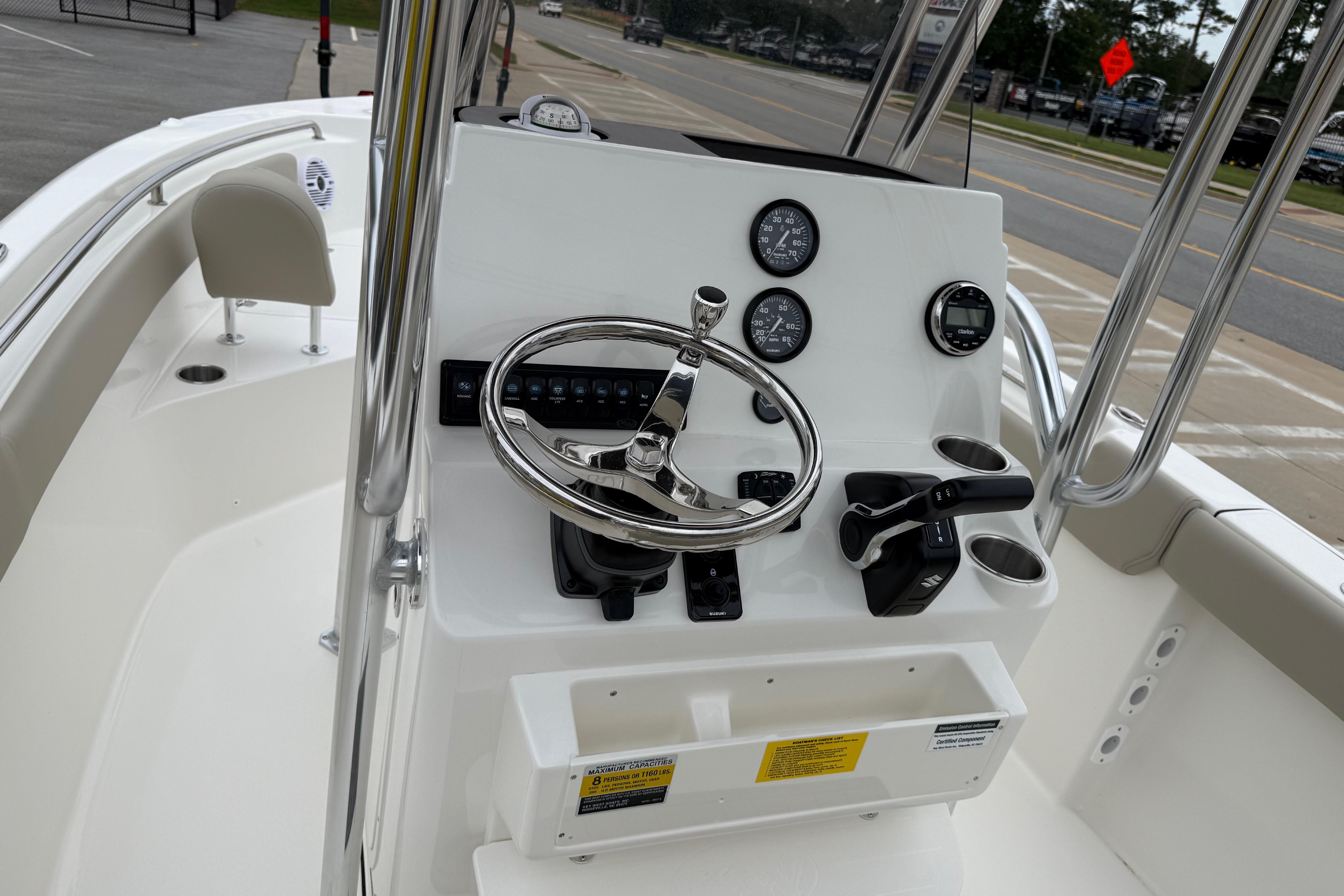 2026 Key West 203 FS boat console with steering wheel and controls.