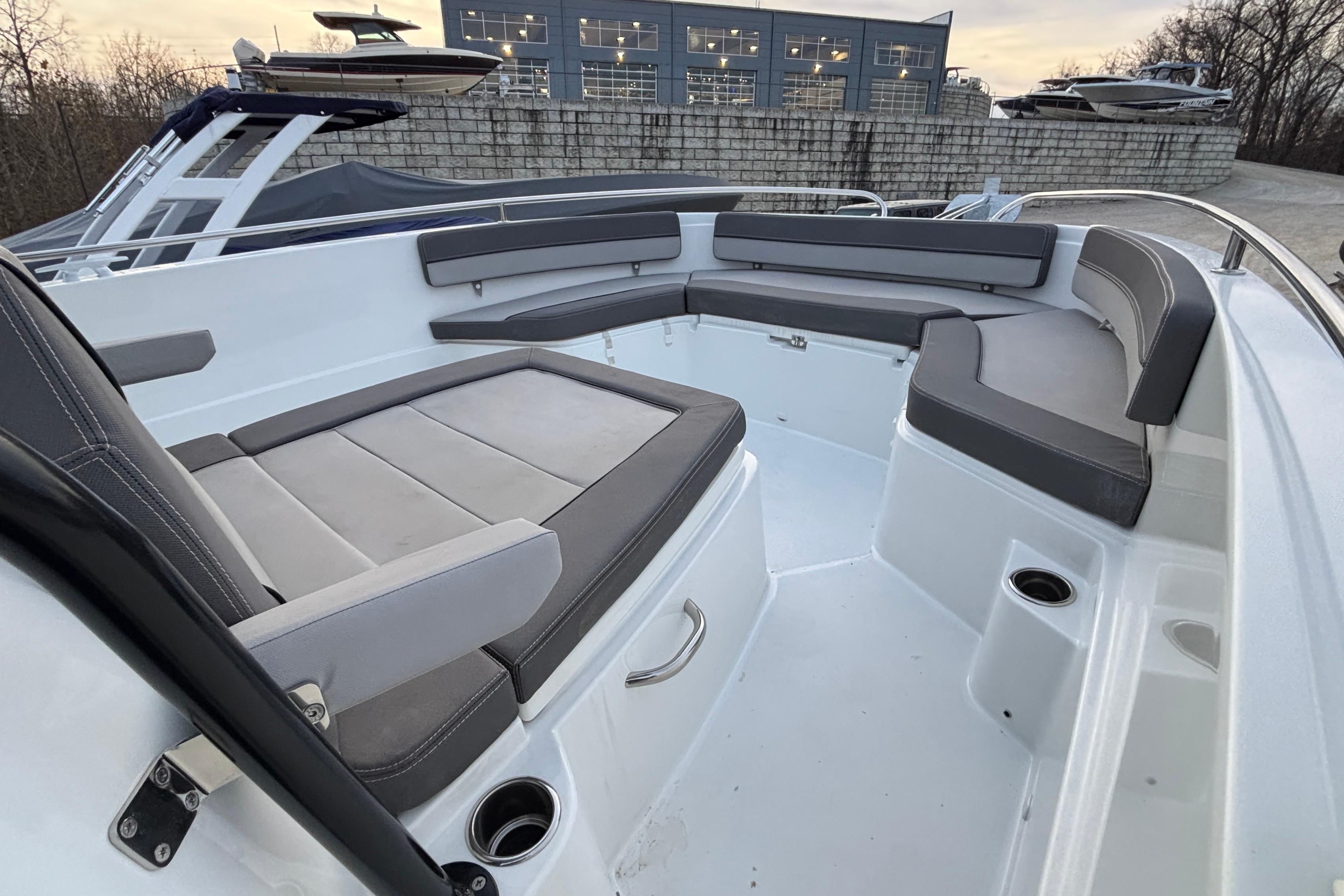 2022 Jeanneau Leader 9.0 CC boat interior with cushioned seating and modern design.