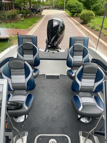 2025 Ranger 1850MS boat interior with modern seating and outboard motor.