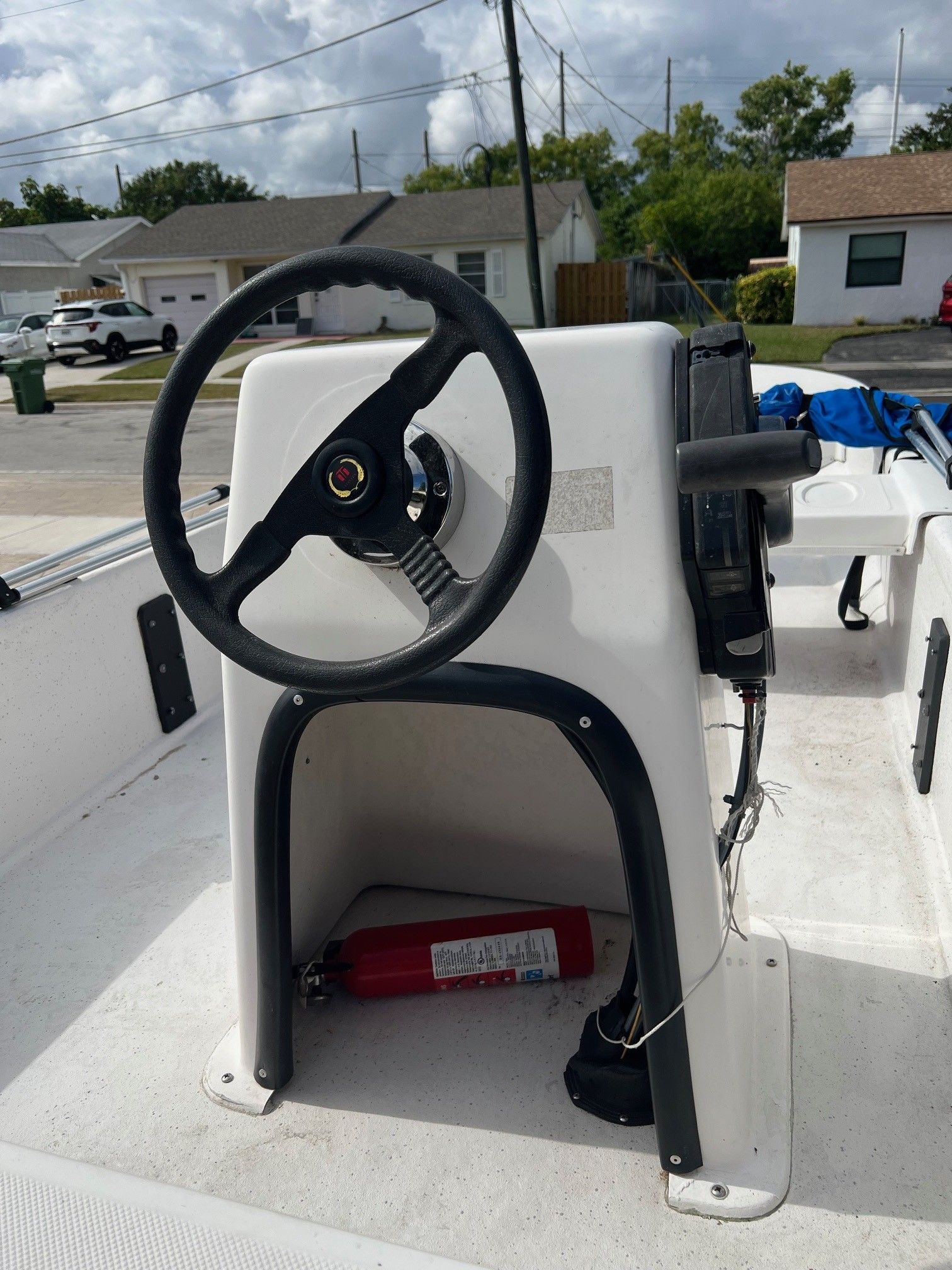2007 Carolina Skiff JV15 steering console with fire extinguisher.