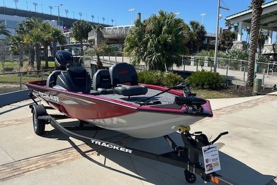 2026 Tracker Pro Team 175 boat on trailer, parked outdoors.