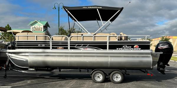 2023 Sun Tracker SportFish 22 XP3 pontoon boat with canopy and trailer.