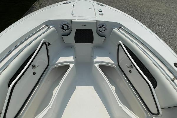 2025 Tidewater 232 CC Adventure boat interior with storage compartments and speakers.