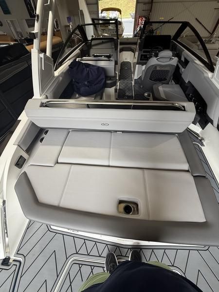 Interior view of a Cobalt R4 boat with gray upholstery and modern design.