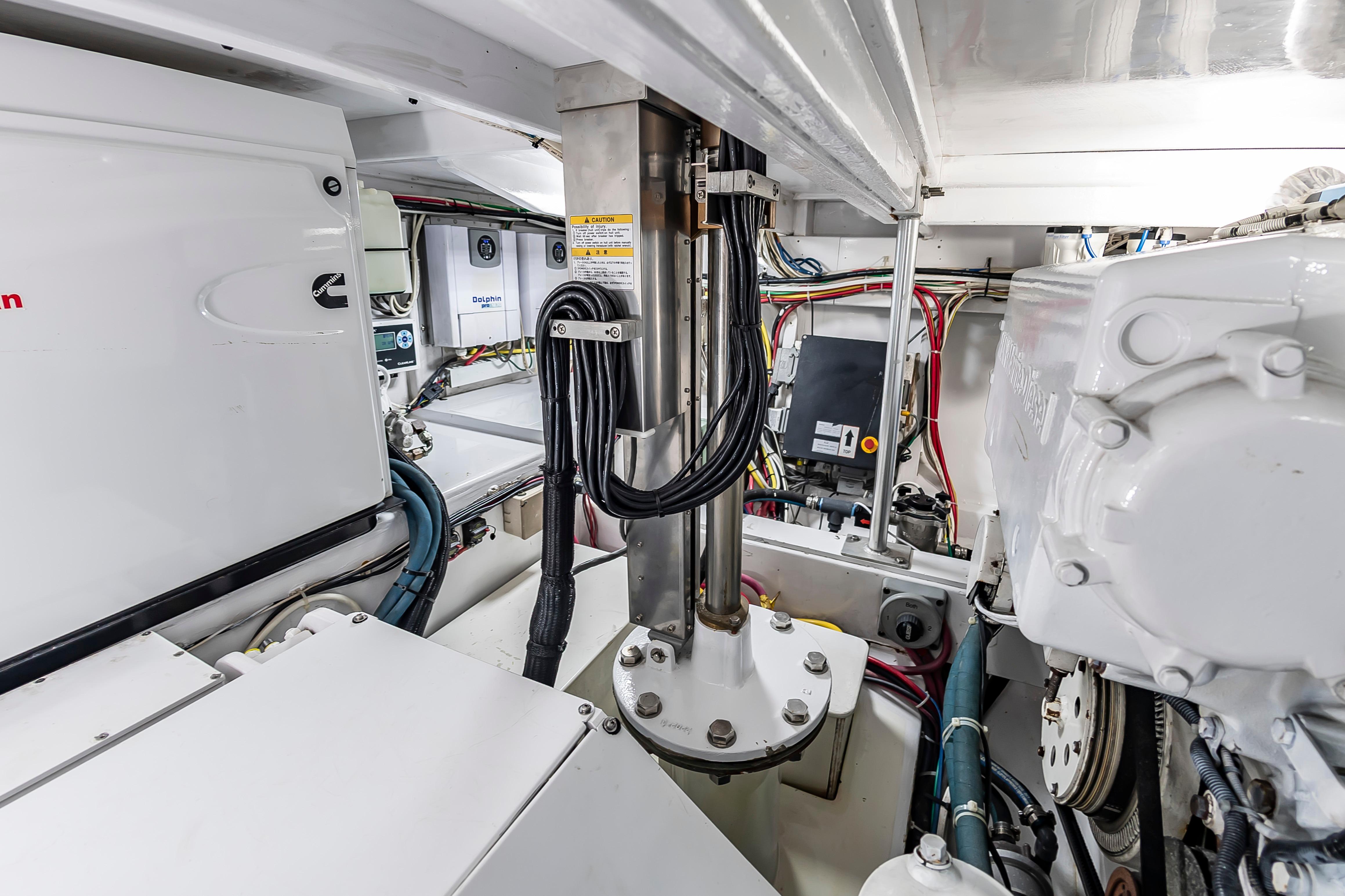 Engine room of 1993 Custom Carolina Scarborough 56 Convertible, showcasing mechanical components and wiring.