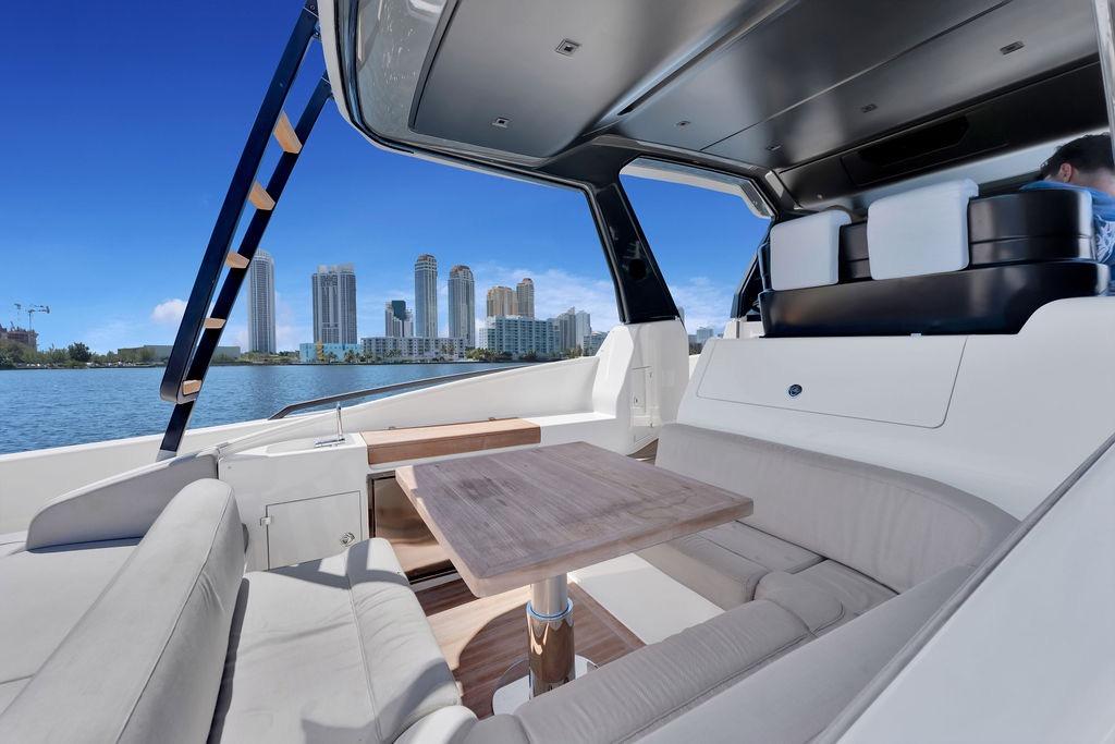 Luxurious 2021 Bluegame BG 42 yacht interior with city skyline view.