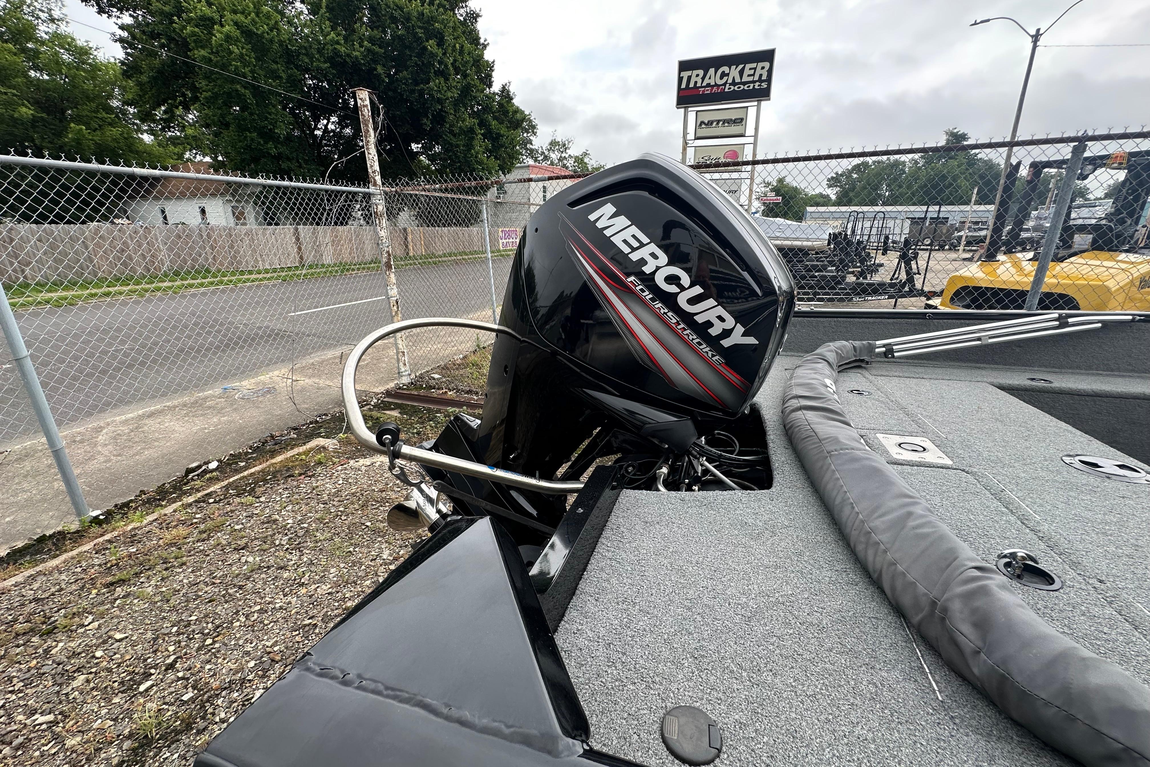 2018 Tracker Pro Guide V-175 Combo boat with Mercury outboard motor in a dealership lot.