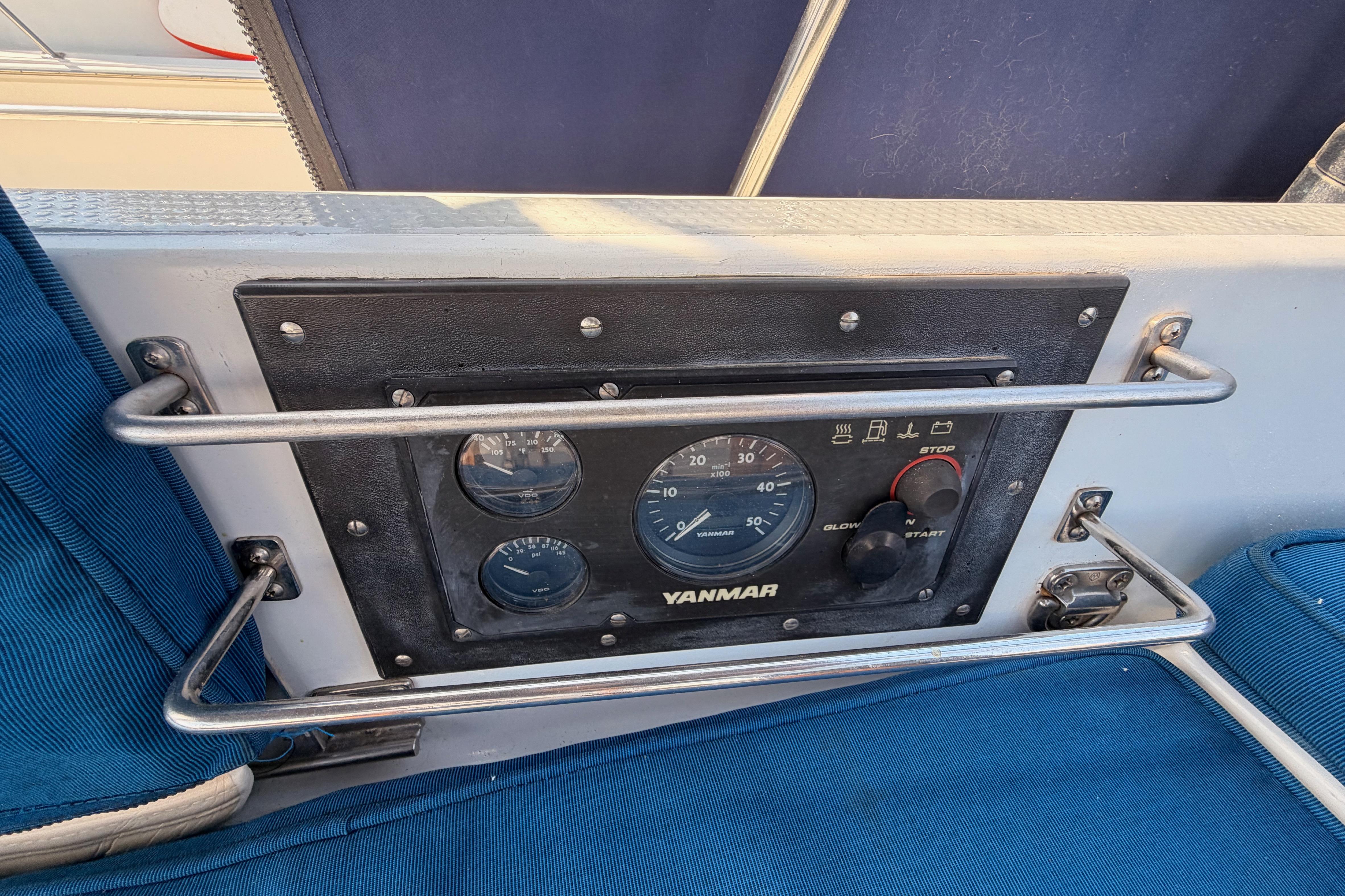 Control panel of a 1991 Hylas 51 yacht featuring Yanmar engine gauges.