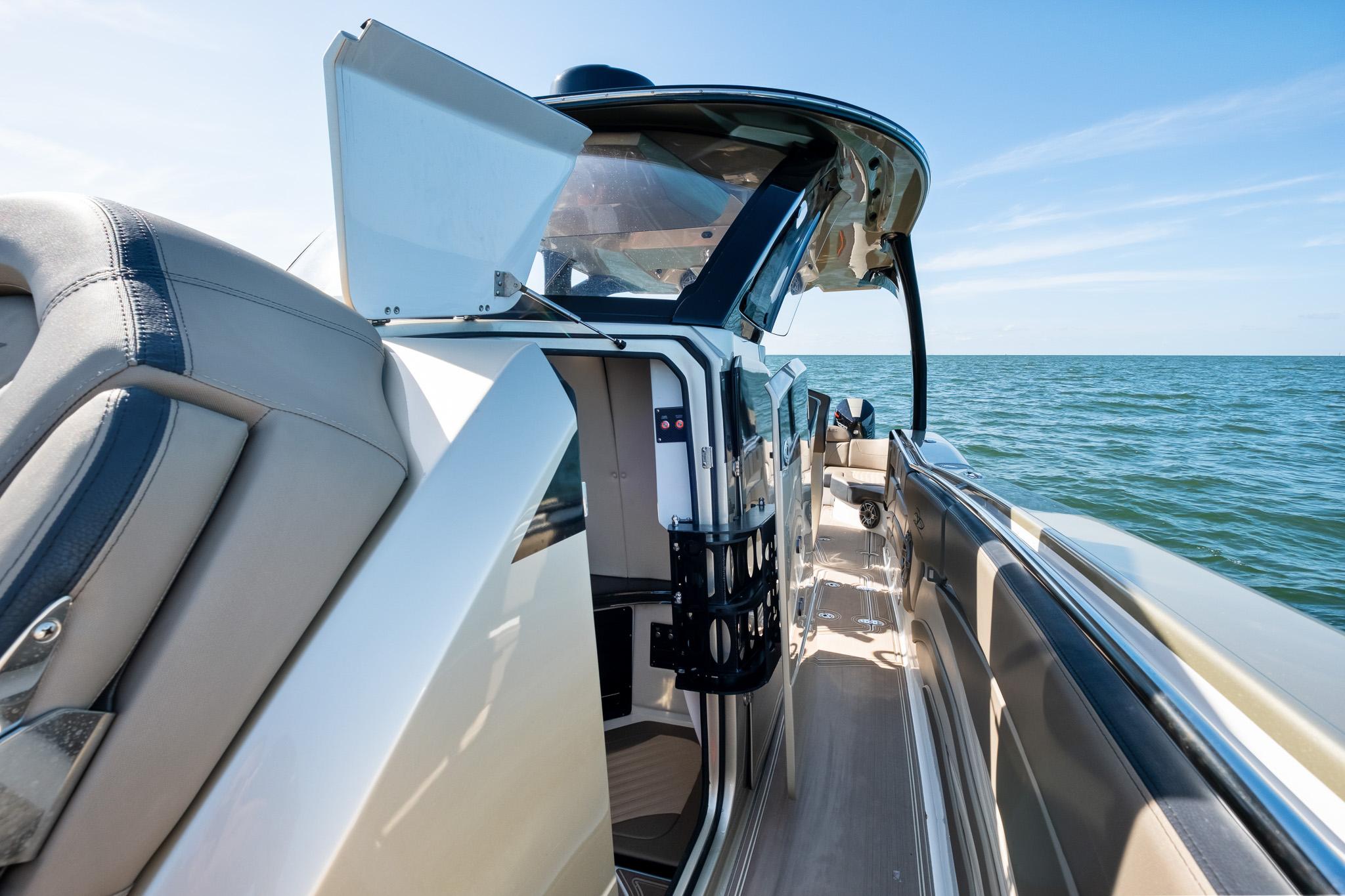 2021 MTI V42 boat interior with open cabin door, ocean view.