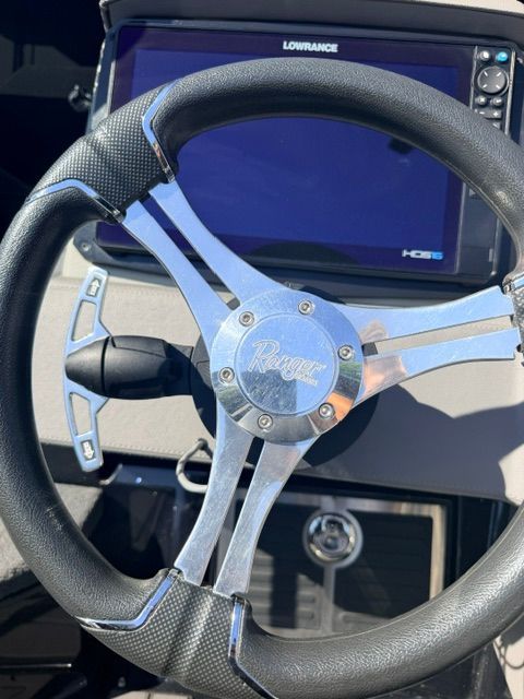 Steering wheel of a 2024 Ranger 621FS Pro with Lowrance screen in the background.