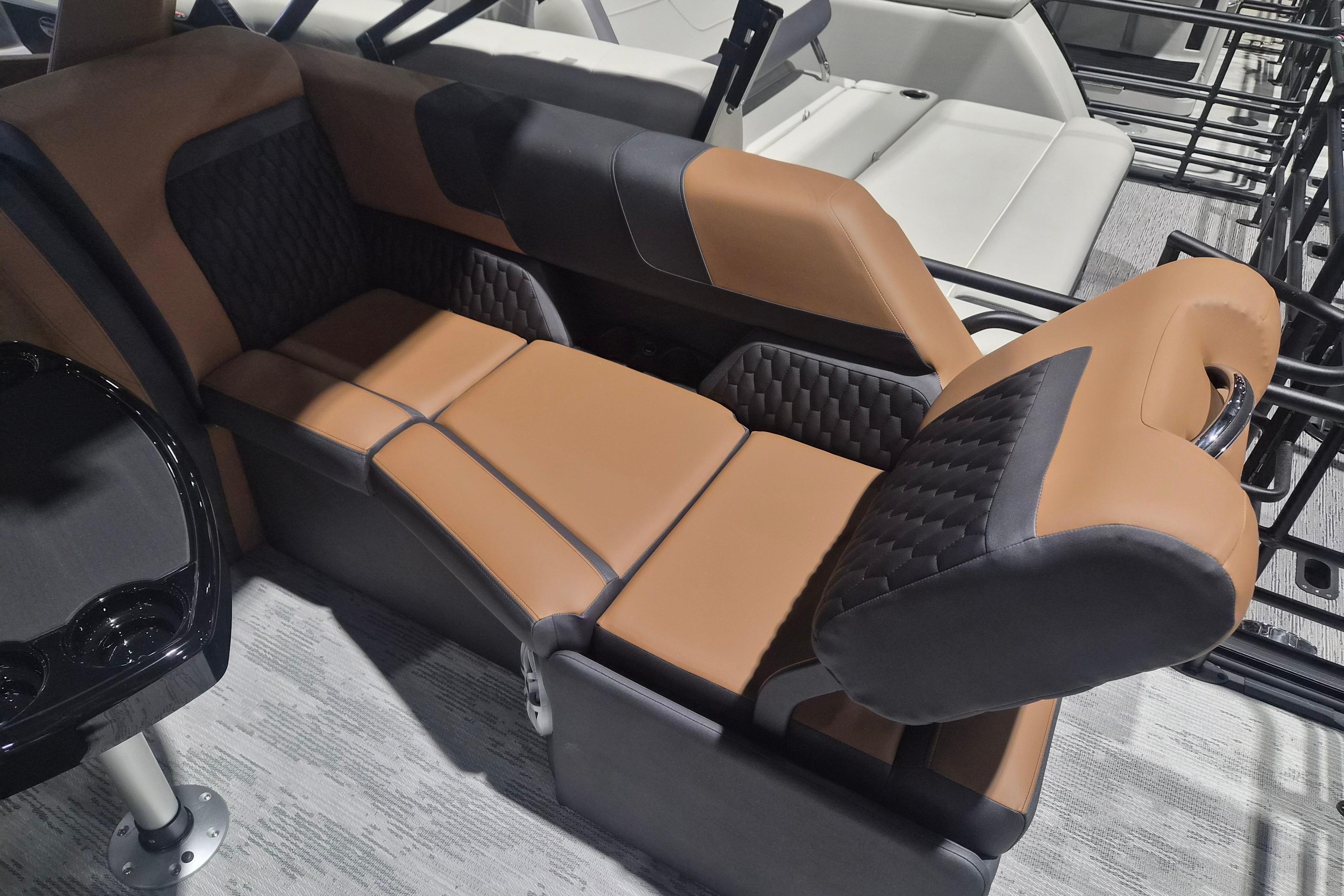 Luxurious seating in the 2026 Sylvan L3 SLZ boat, featuring brown and black upholstery.