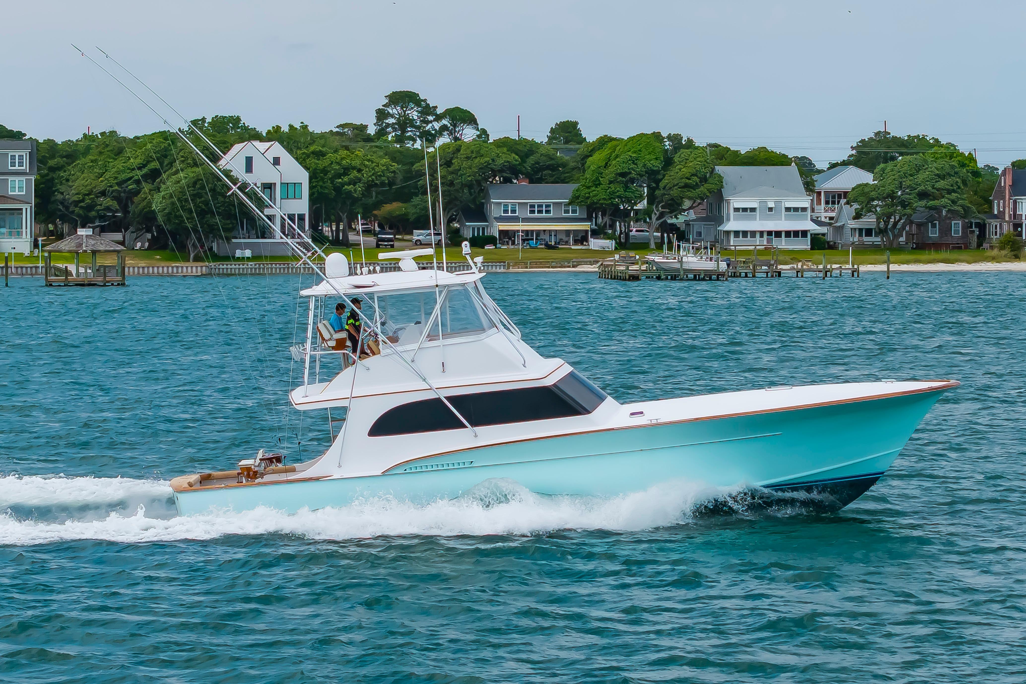 Custom Carolina Scarborough 56 Convertible yacht cruising on blue waters, 1993 model.
