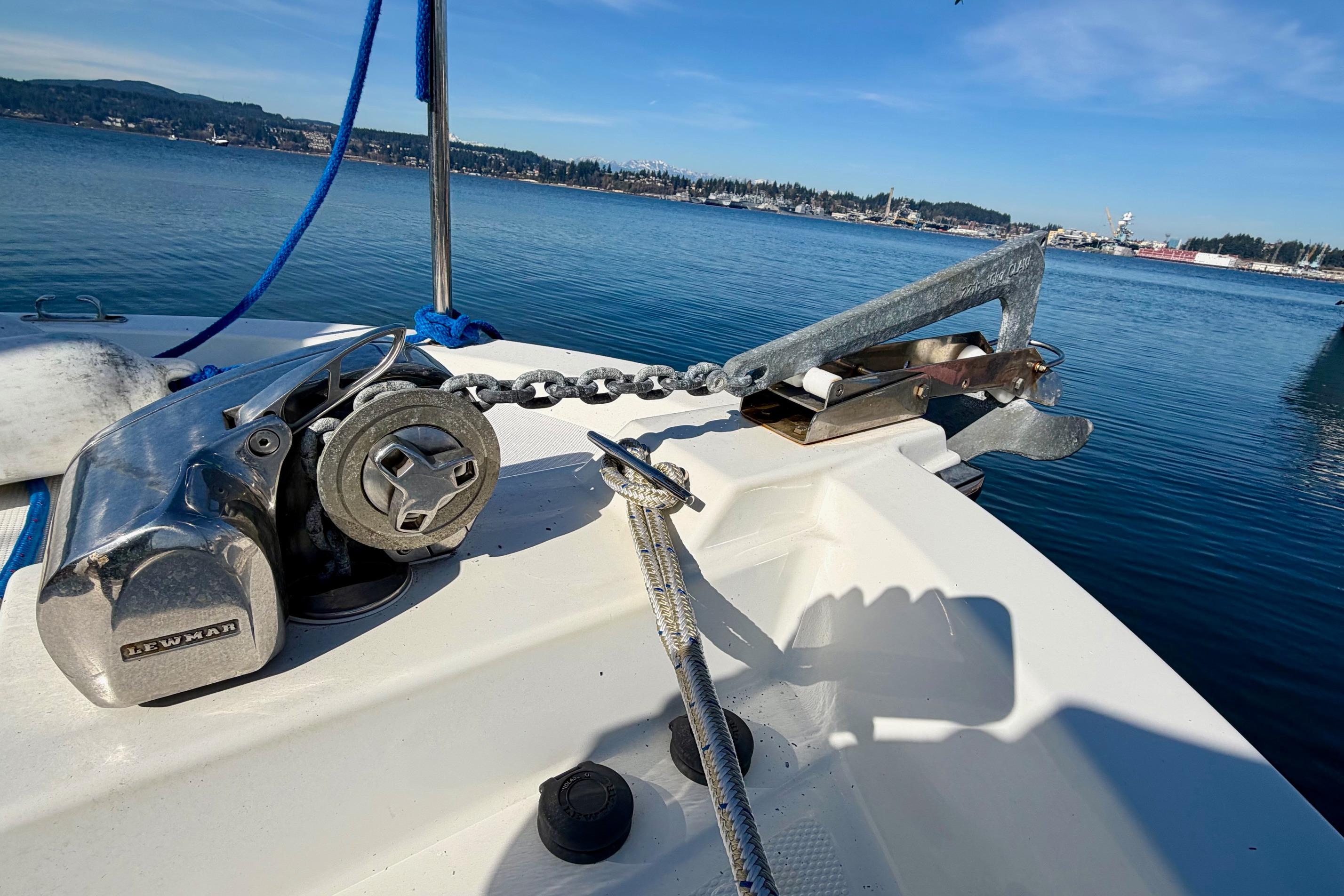 Anchor and winch on 2012 Ranger Tugs R-29 boat, docked in calm waters.