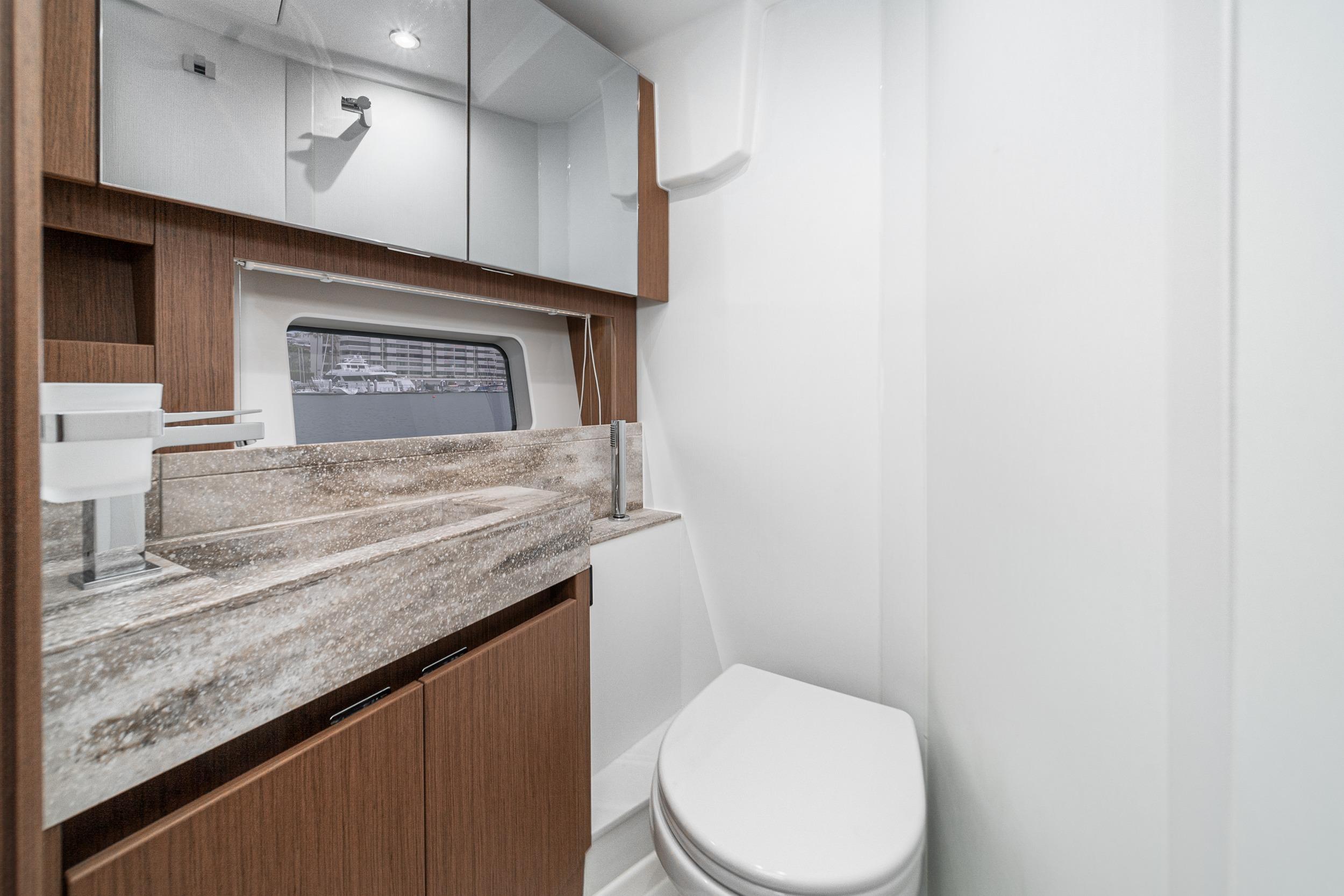 Luxurious bathroom in 2024 Prestige X60 yacht with modern fixtures and elegant design.