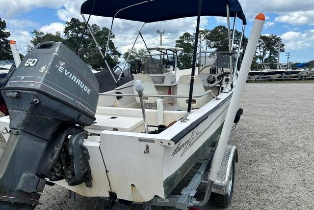 1989 Henry O 150 Dual Console boat with Evinrude motor on a trailer.