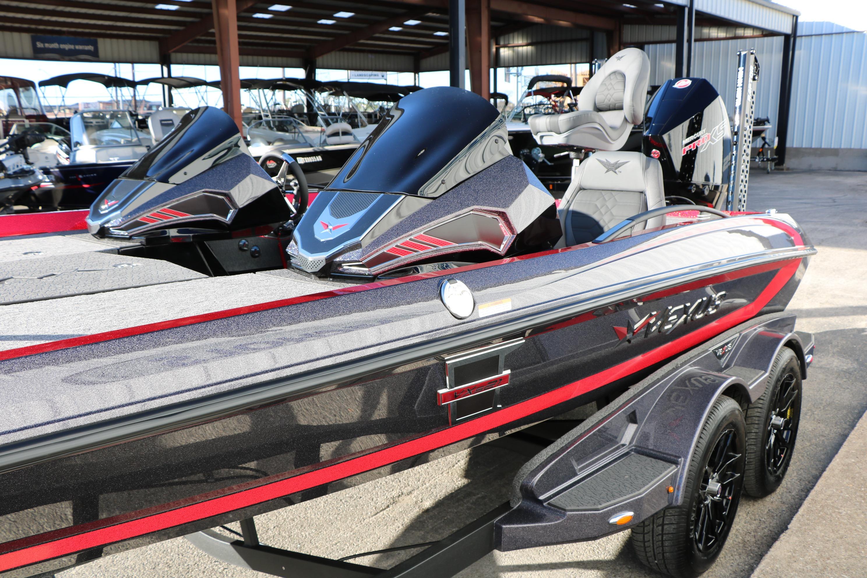 2026 Vexus VXs21 boat with sleek design and modern features in a showroom.