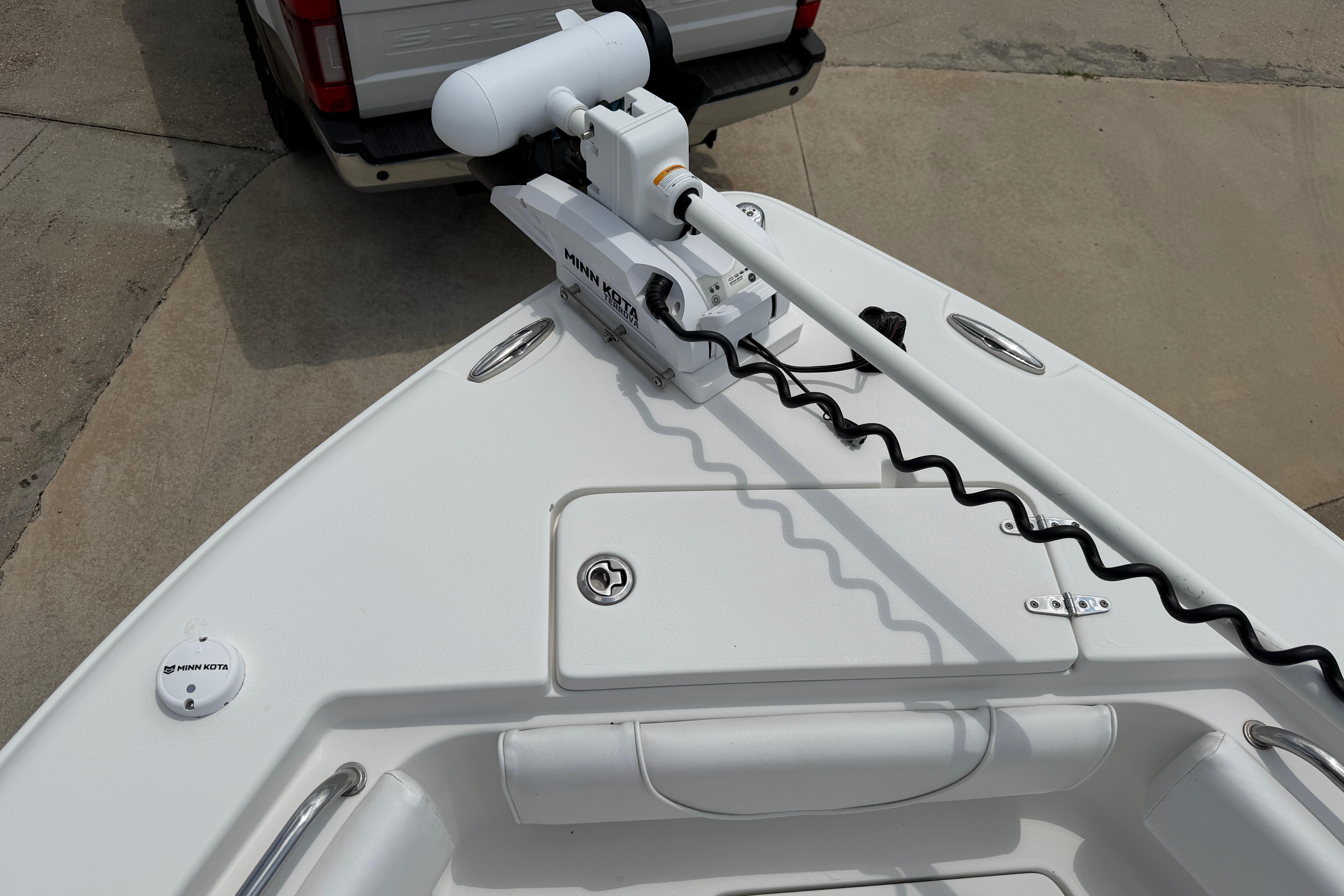2015 Sea Hunt Triton 225 boat with Minn Kota trolling motor attached at the bow.