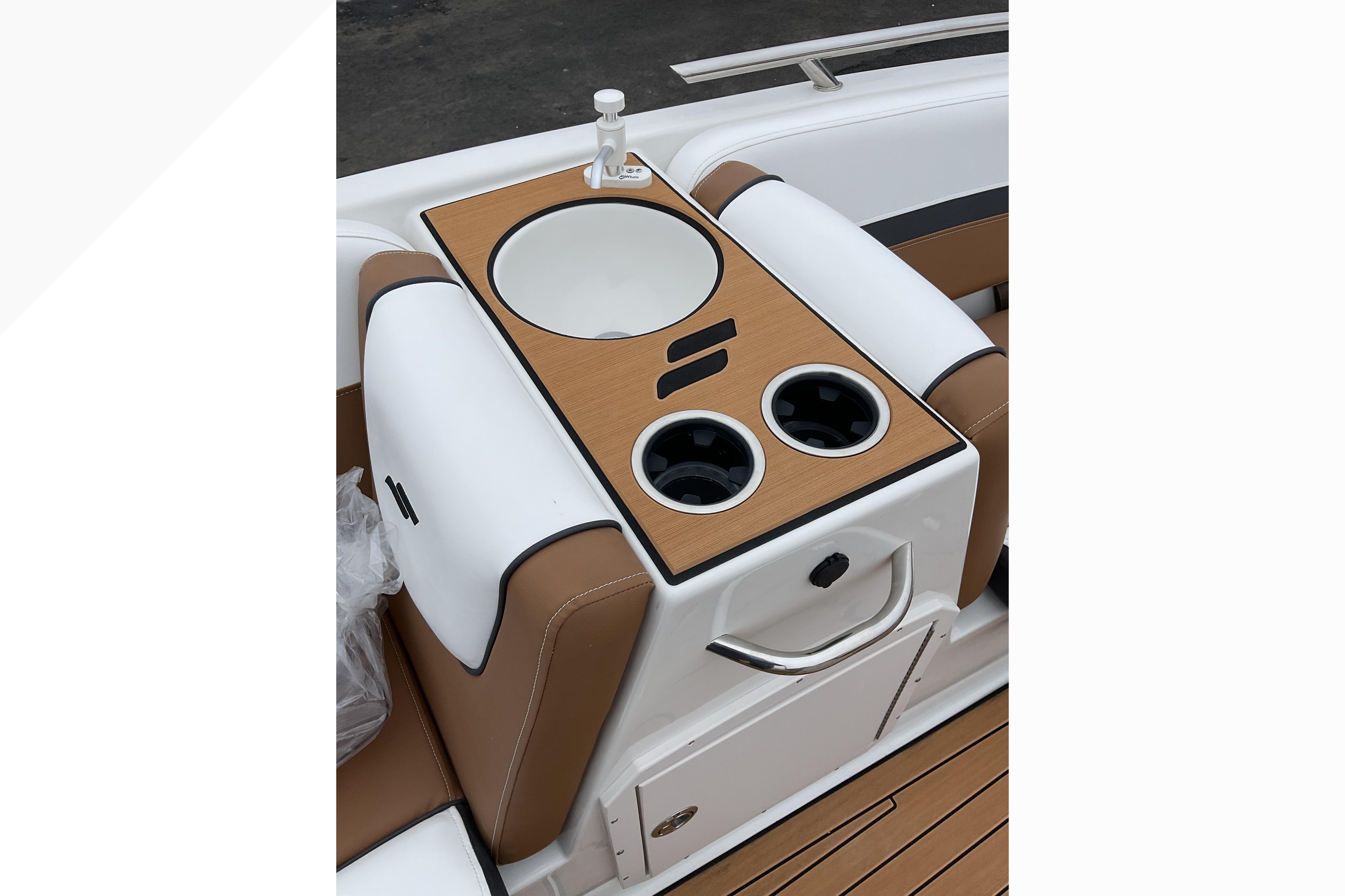 2026 Starcraft SVX 211 OB boat interior with sink and cup holders.
