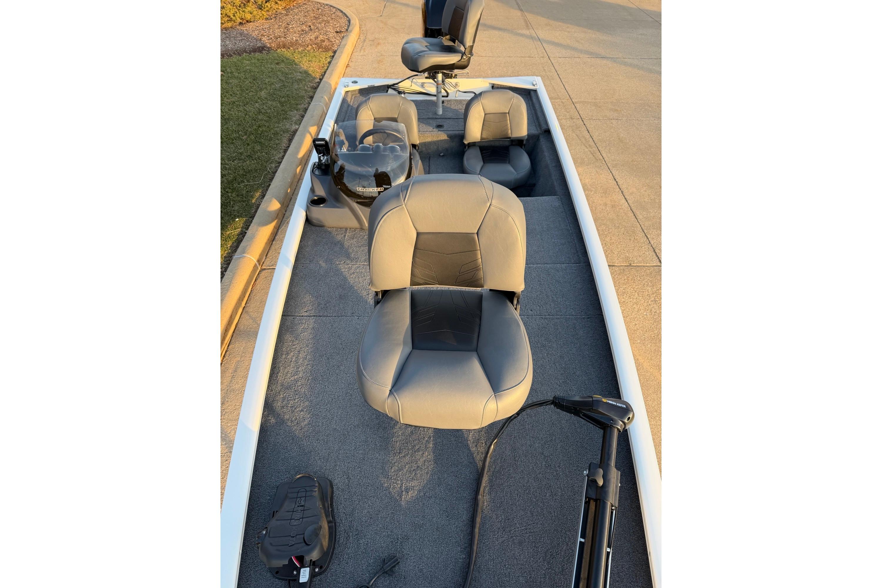 2026 Tracker Pro 170 boat interior with gray seating and steering console.