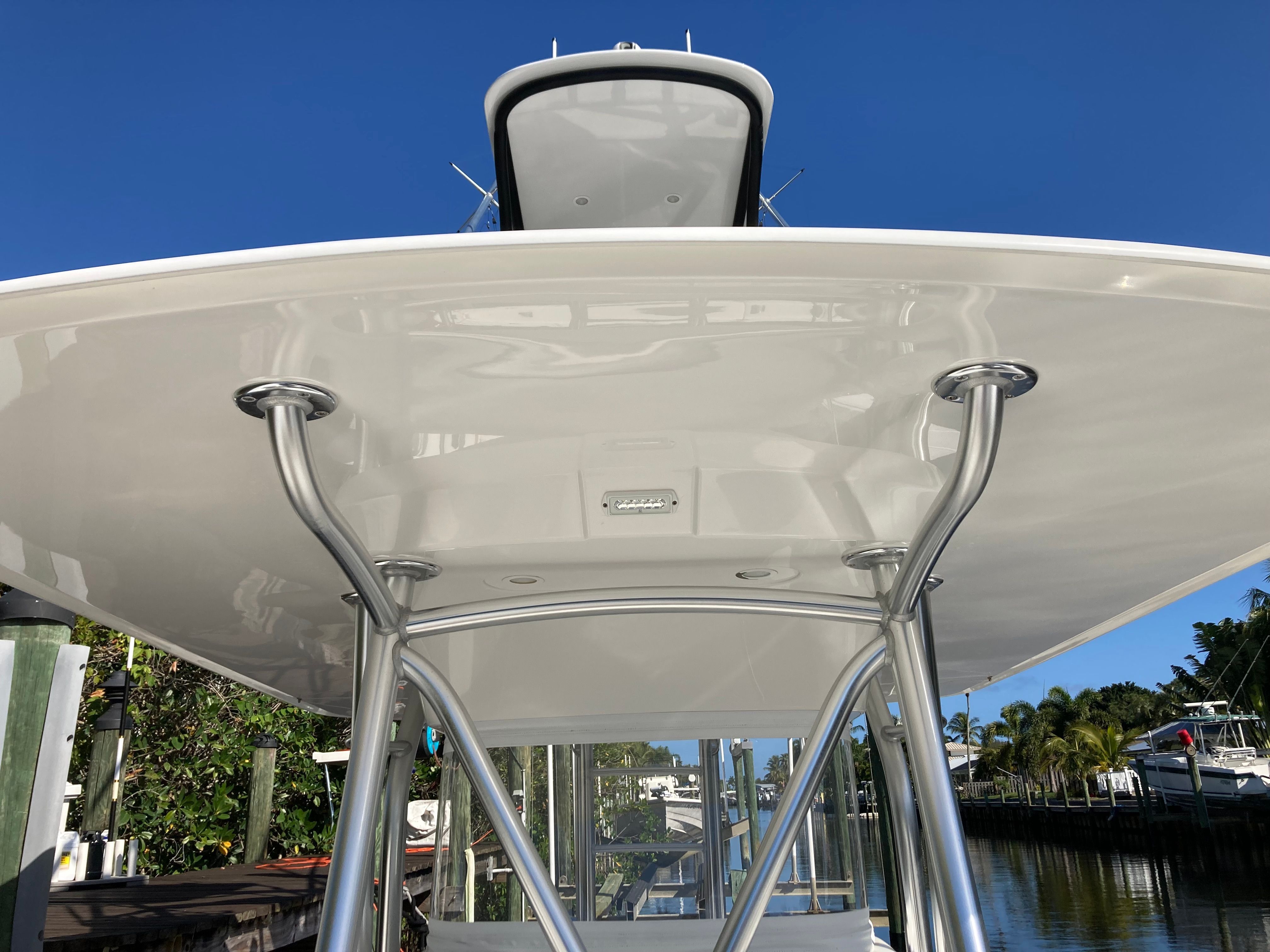 Venture CC 2019 boat with T-top against blue sky.
