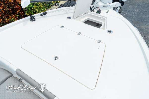 2025 Caymas 281 HB boat deck with storage compartment and trolling motor.