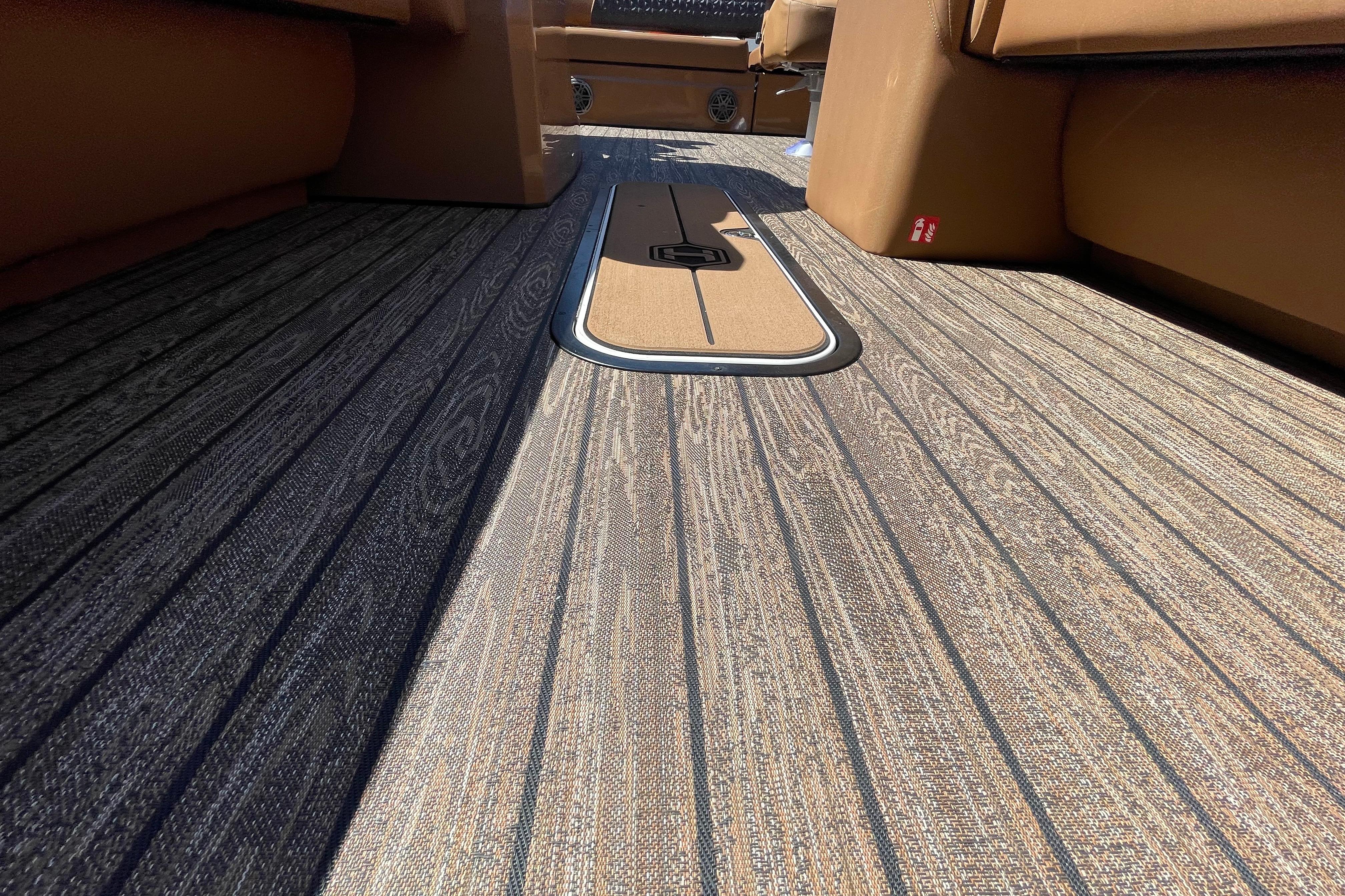 2026 Harris Solstice 250 SLDH boat interior with stylish wood-patterned flooring.