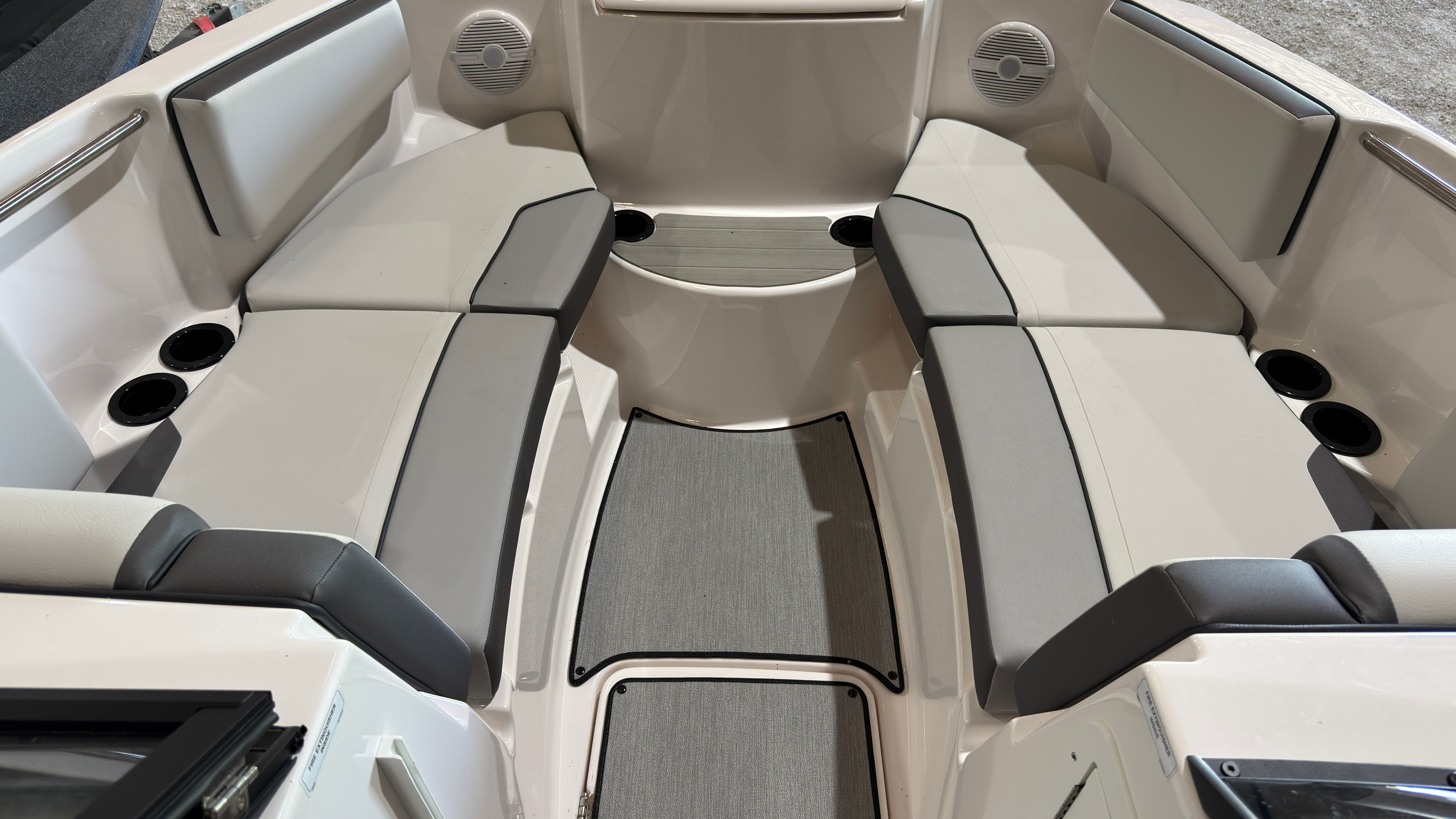 Interior of 2024 Yamaha AR220 boat with gray upholstery.
