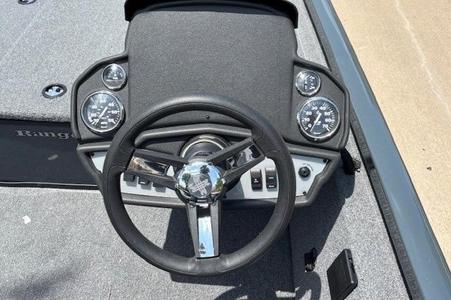 Steering wheel and dashboard of 2026 Ranger RT188 boat, featuring gauges and controls.