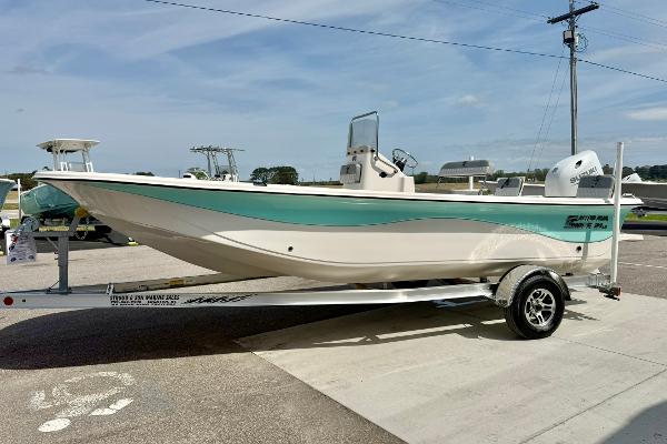 2025 Carolina Skiff 21 LS boat on trailer, displayed outdoors under clear sky.