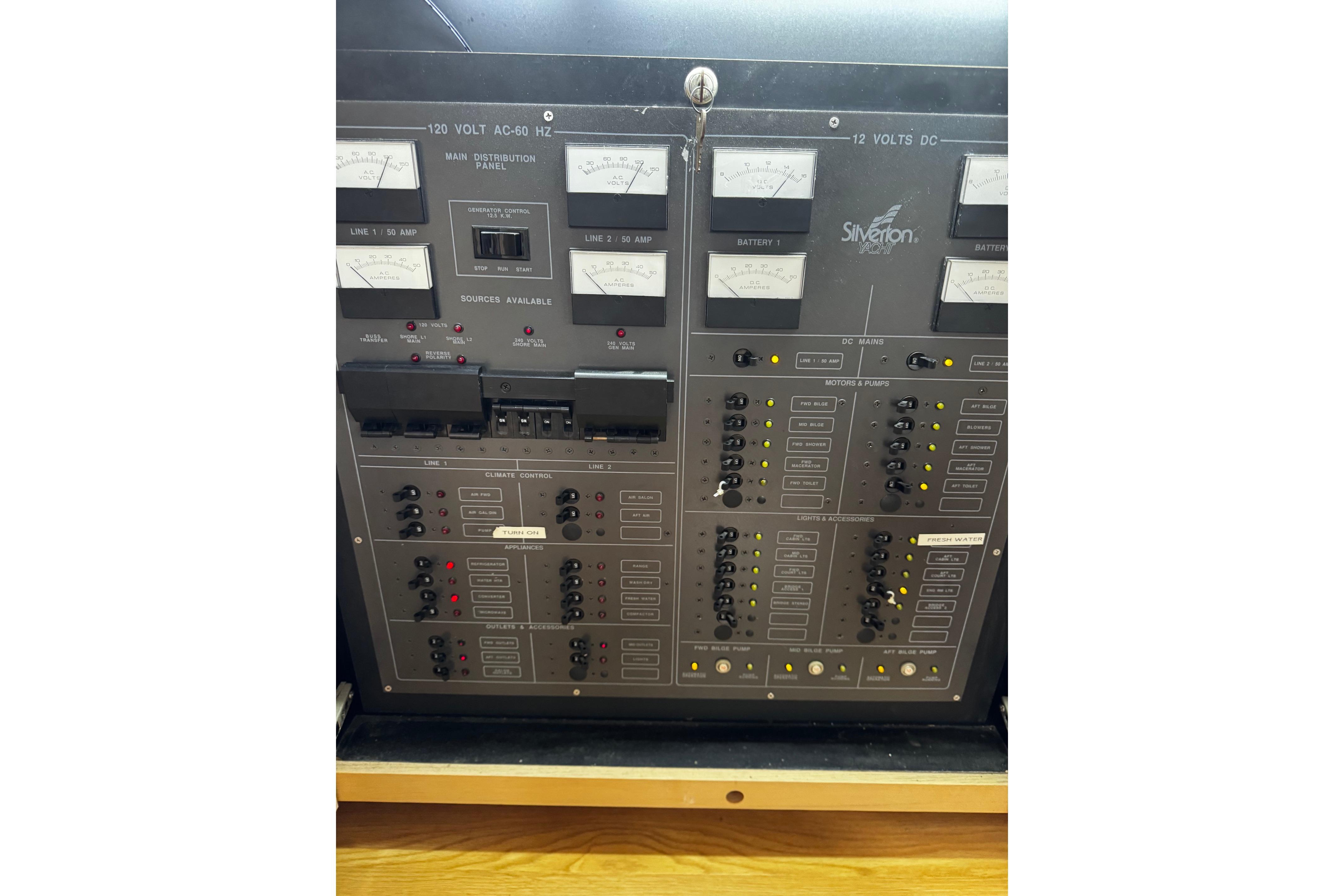 Electrical control panel of a 1991 Silverton 46 Motor Yacht, featuring gauges and switches.