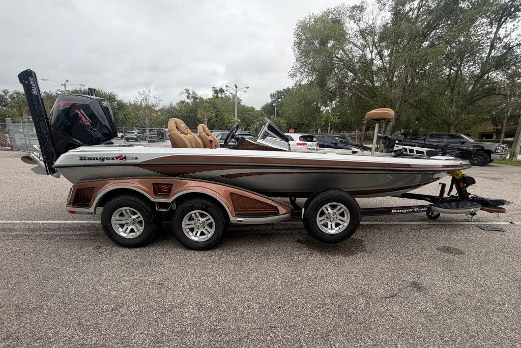 2026 Ranger Z520R boat on trailer, parked outdoors, showcasing sleek design and dual-axle wheels.