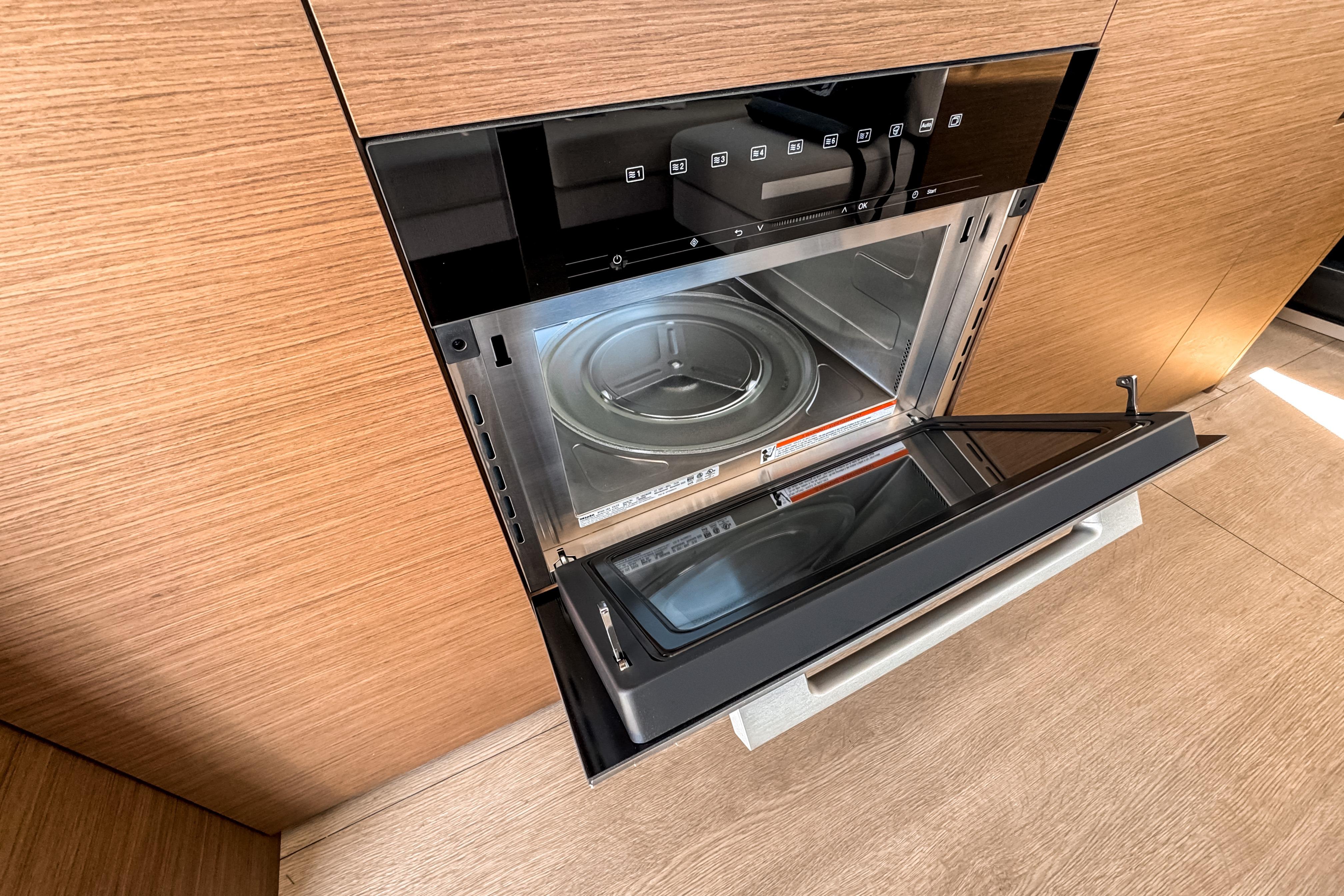 Modern microwave in Wellcraft 44 Explorer yacht, year 2026.