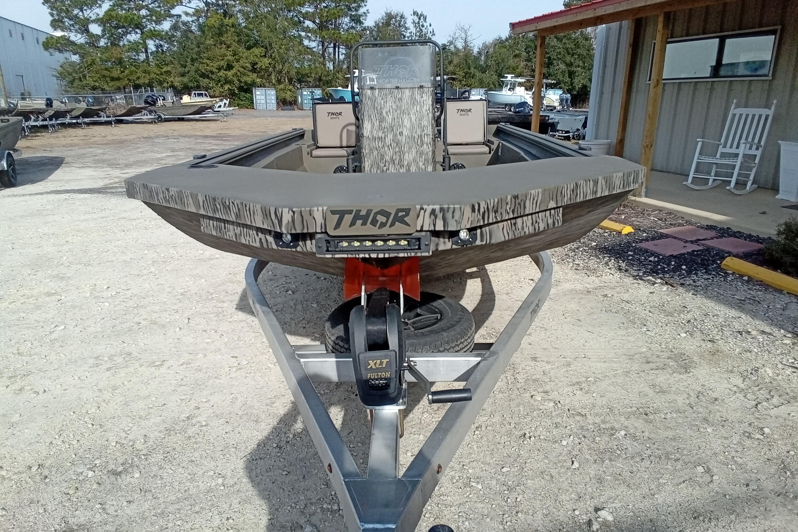 2026 Thor 1900 Low Country Elite boat on trailer, outdoor setting.